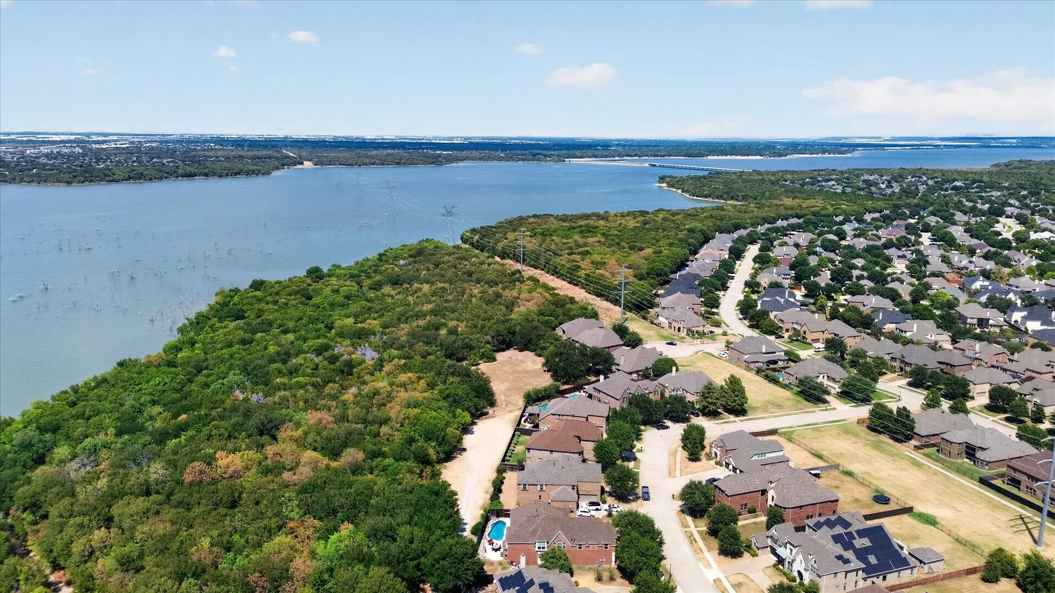This home has no rear neighbors! Just a narrow dirt road separates you from the Corps of Engineers land surrounding Joe Pool Lake