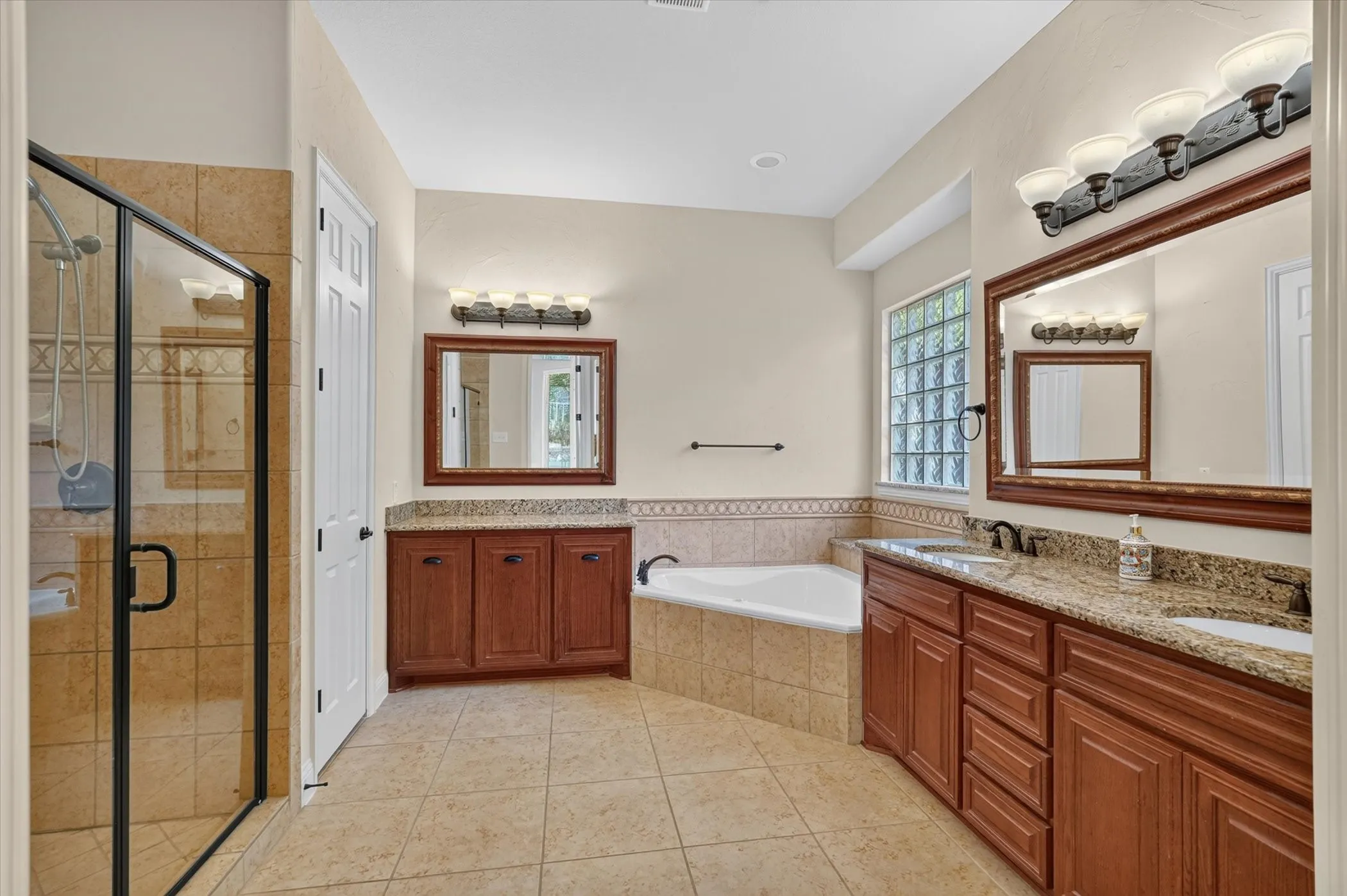 The primary bathroom has a large walk in closet attached