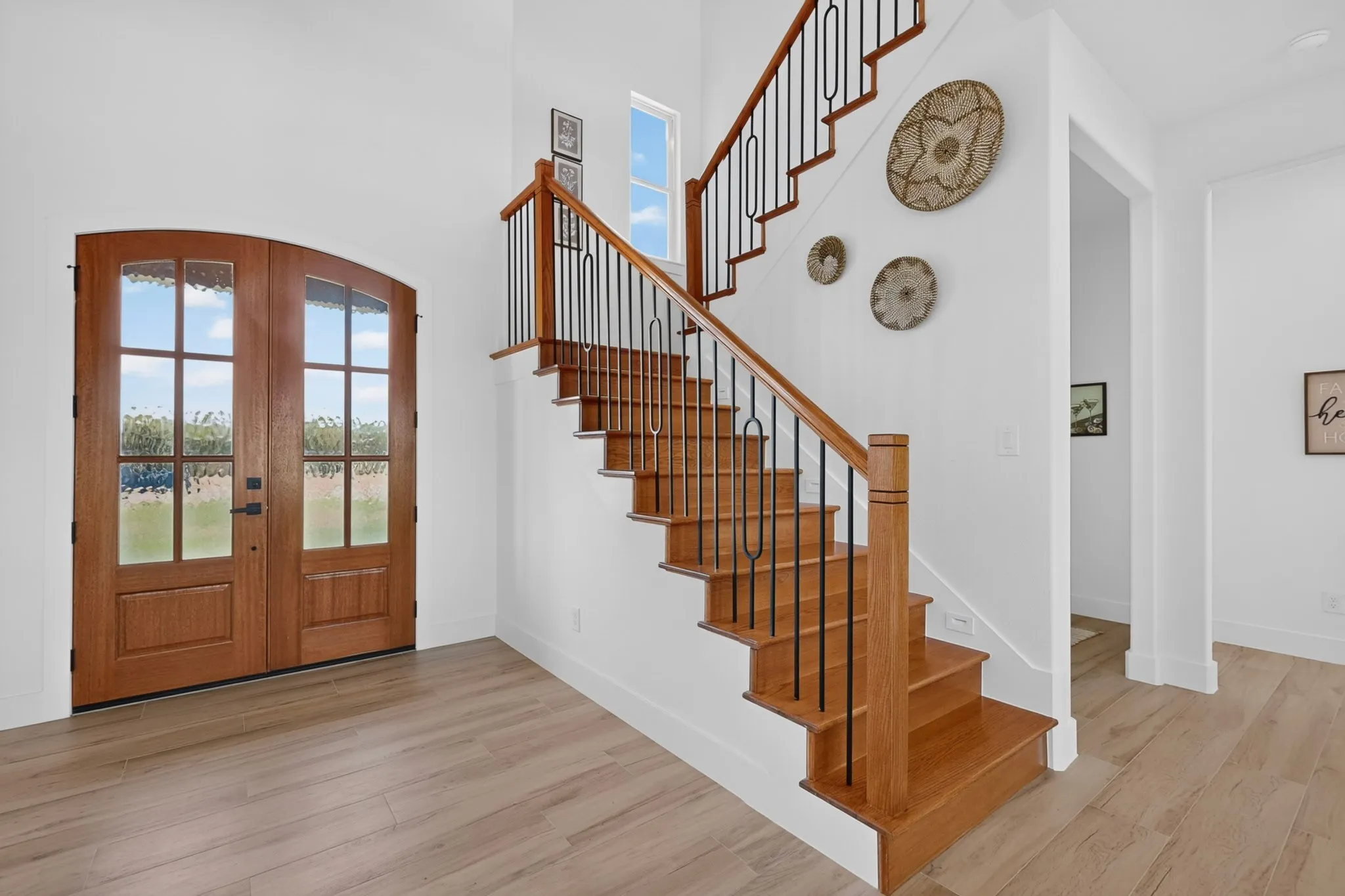 Arch-top double entry doors with decorative glass panels