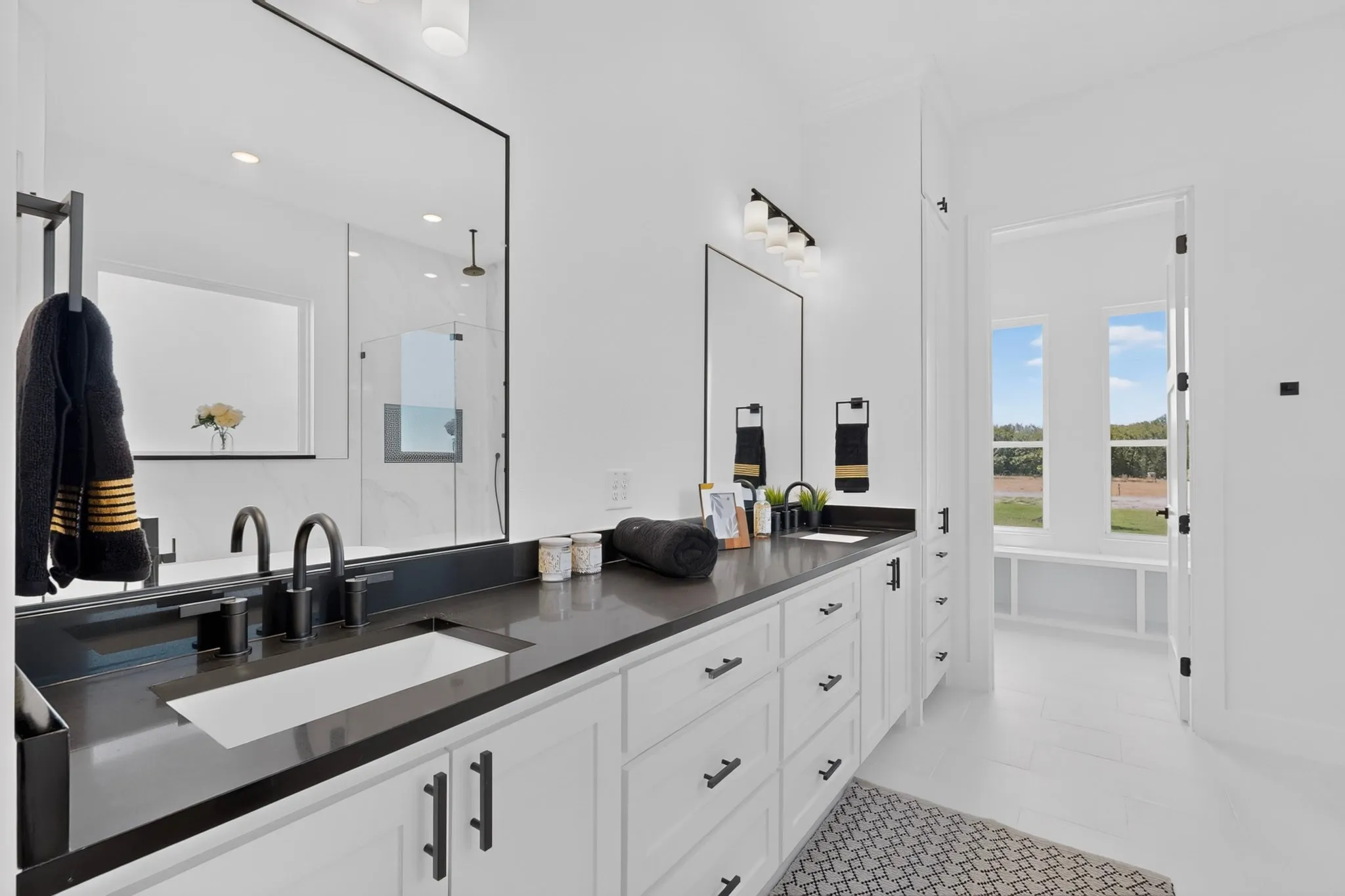 Dual vanity with integrated sinks and matte black fixtures