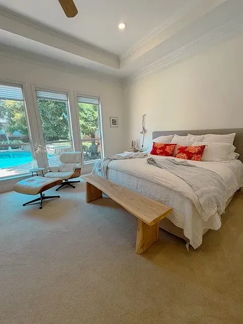 Tray ceiling with crown molding, recessed lighting, and ceiling fan