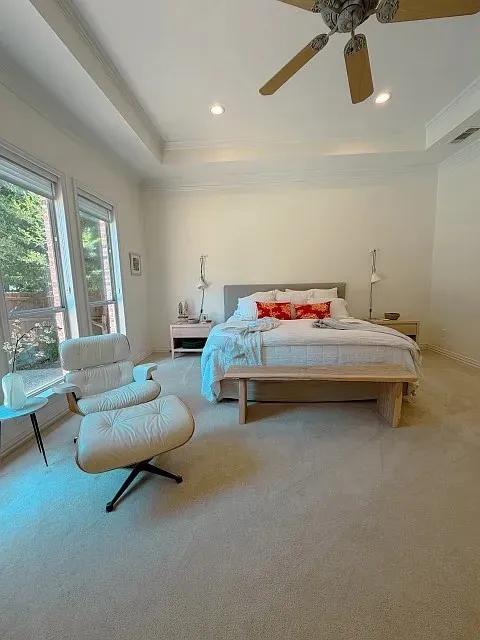 Tray ceiling with recessed lighting and crown molding