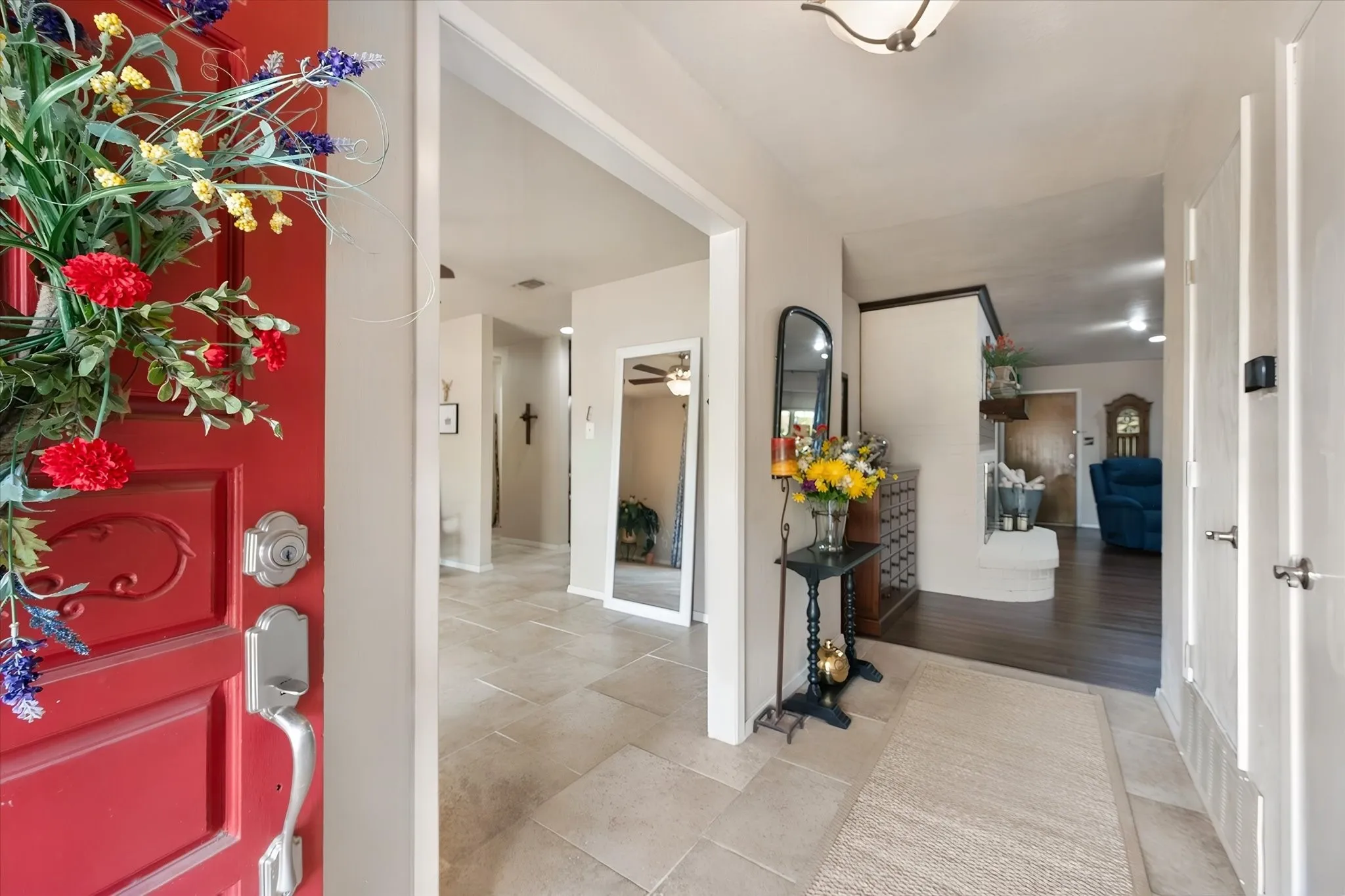 Entry with large scale tile continuing through the dining room.