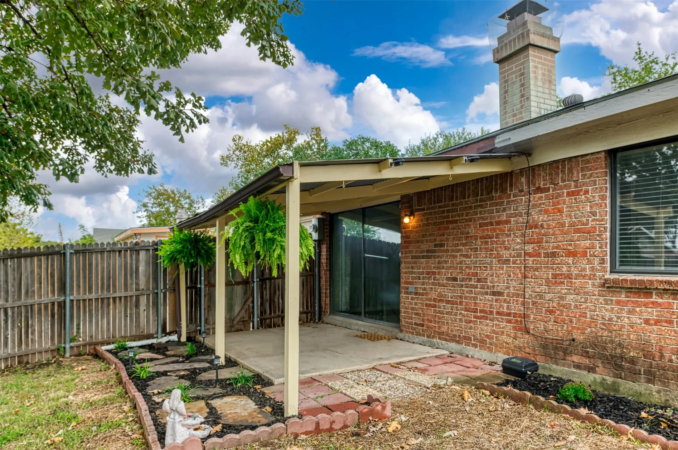 Brick exterior with a covered patio