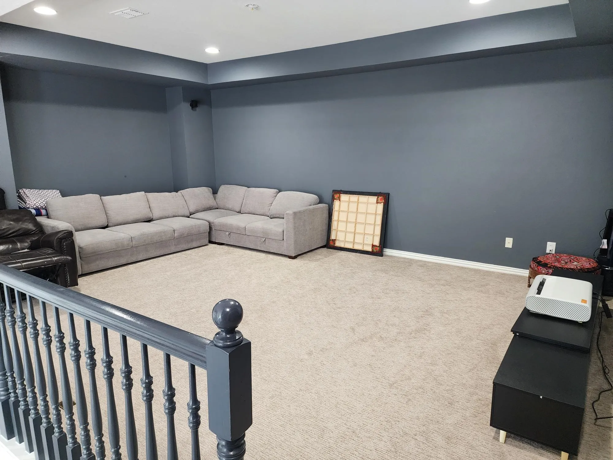 Recessed lighting, wall-to-wall carpeting, and painted walls
