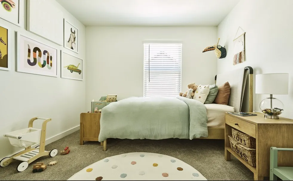 Bedroom with carpet flooring and baseboards