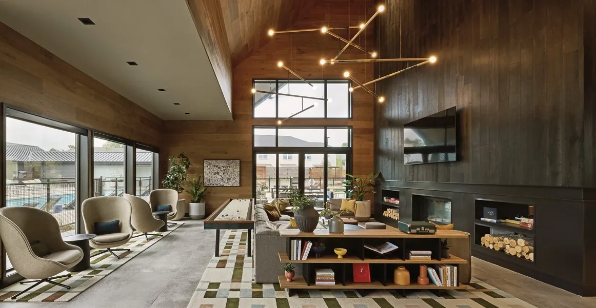 Community lobby with a towering ceiling and wooden walls