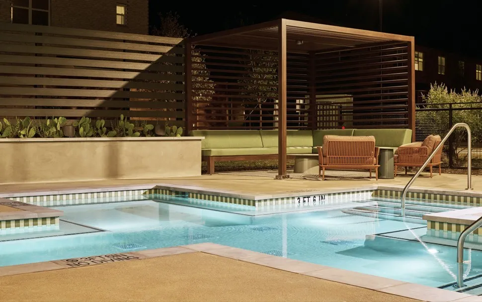 Community pool featuring a patio