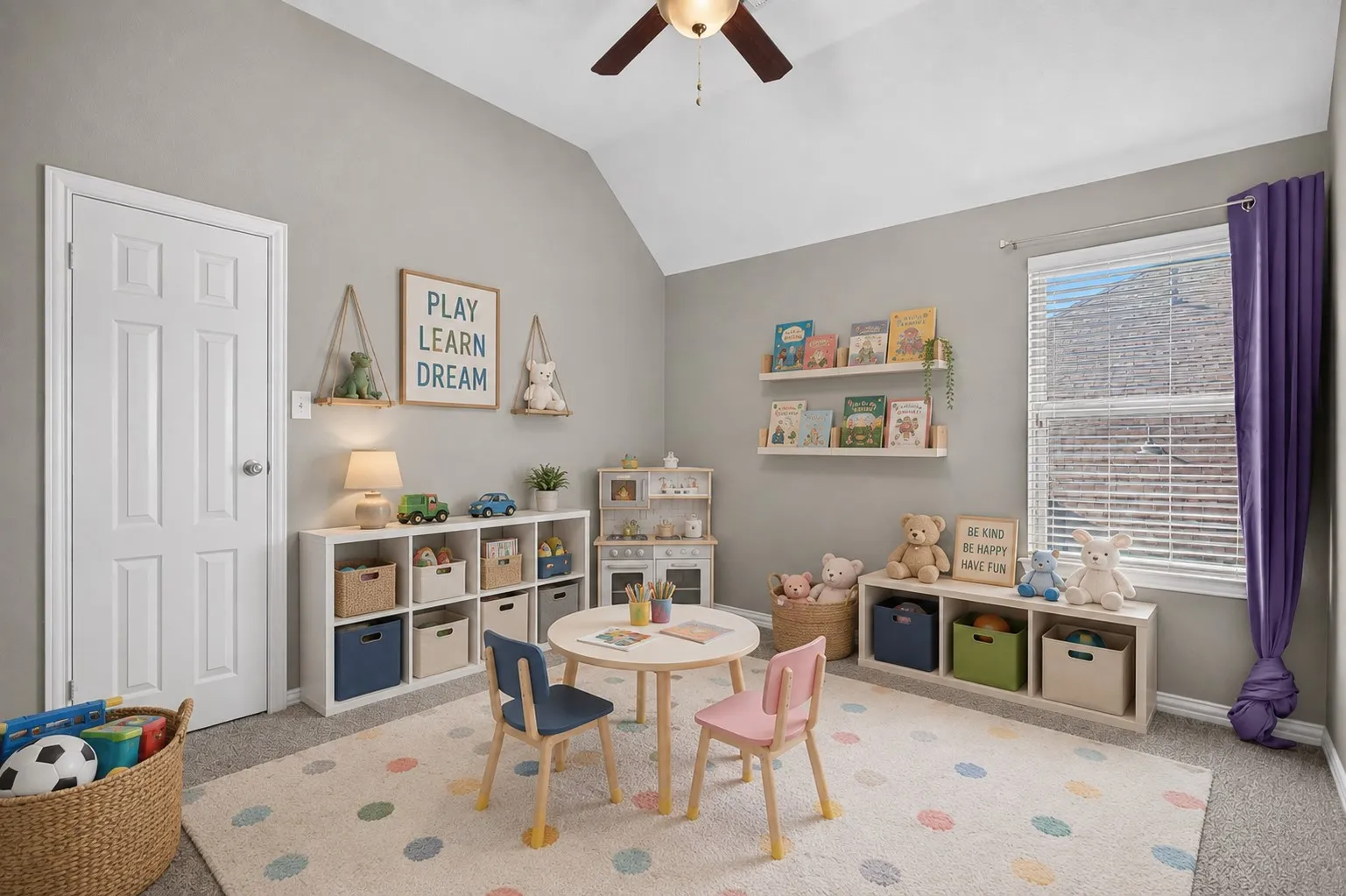 Vaulted ceiling with a ceiling fan, window with blinds, and recessed shelving