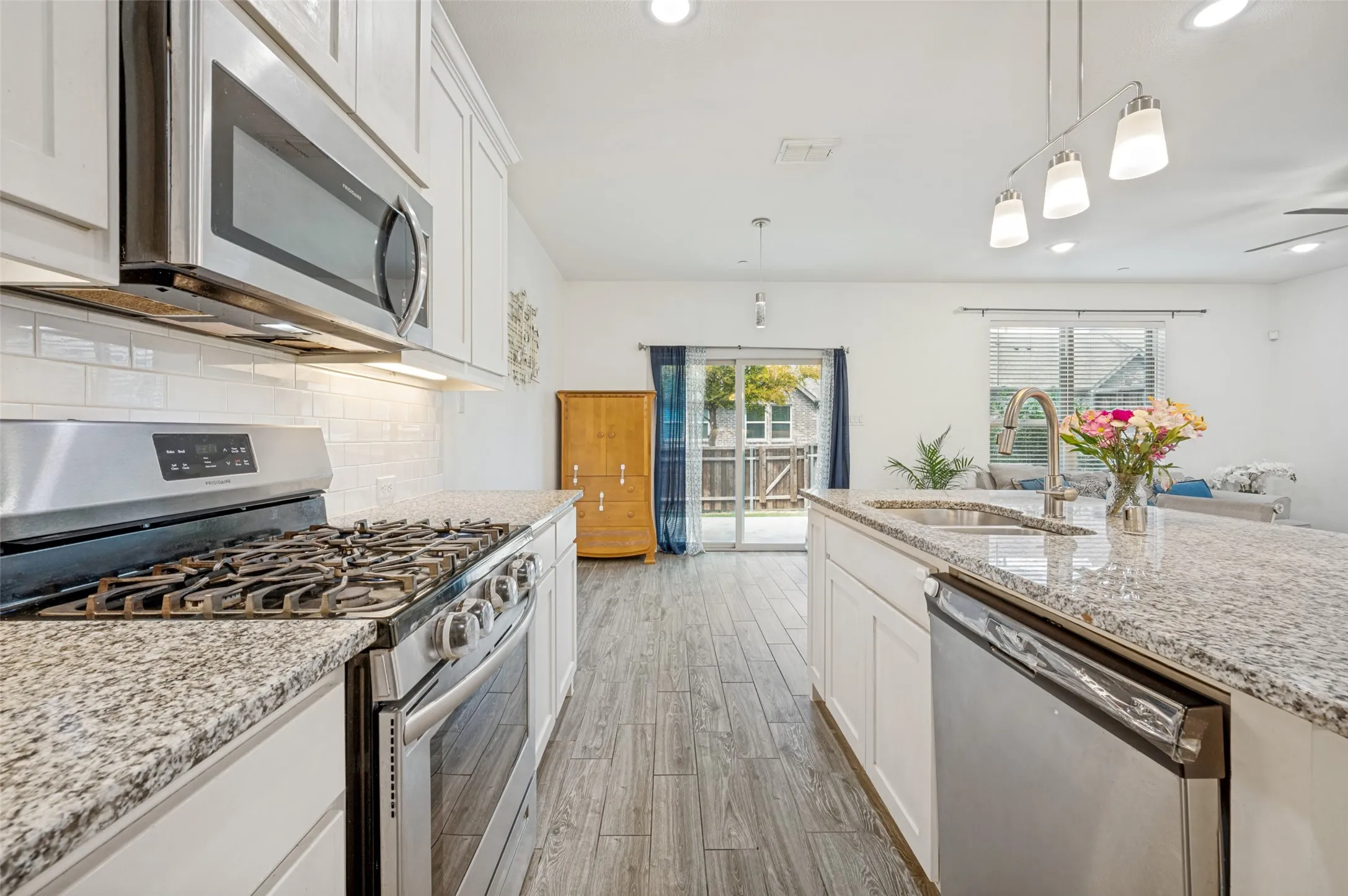 Gas range, Stainless built in microwave, oven and dishwasher. Refrigerator conveys with sale of property.