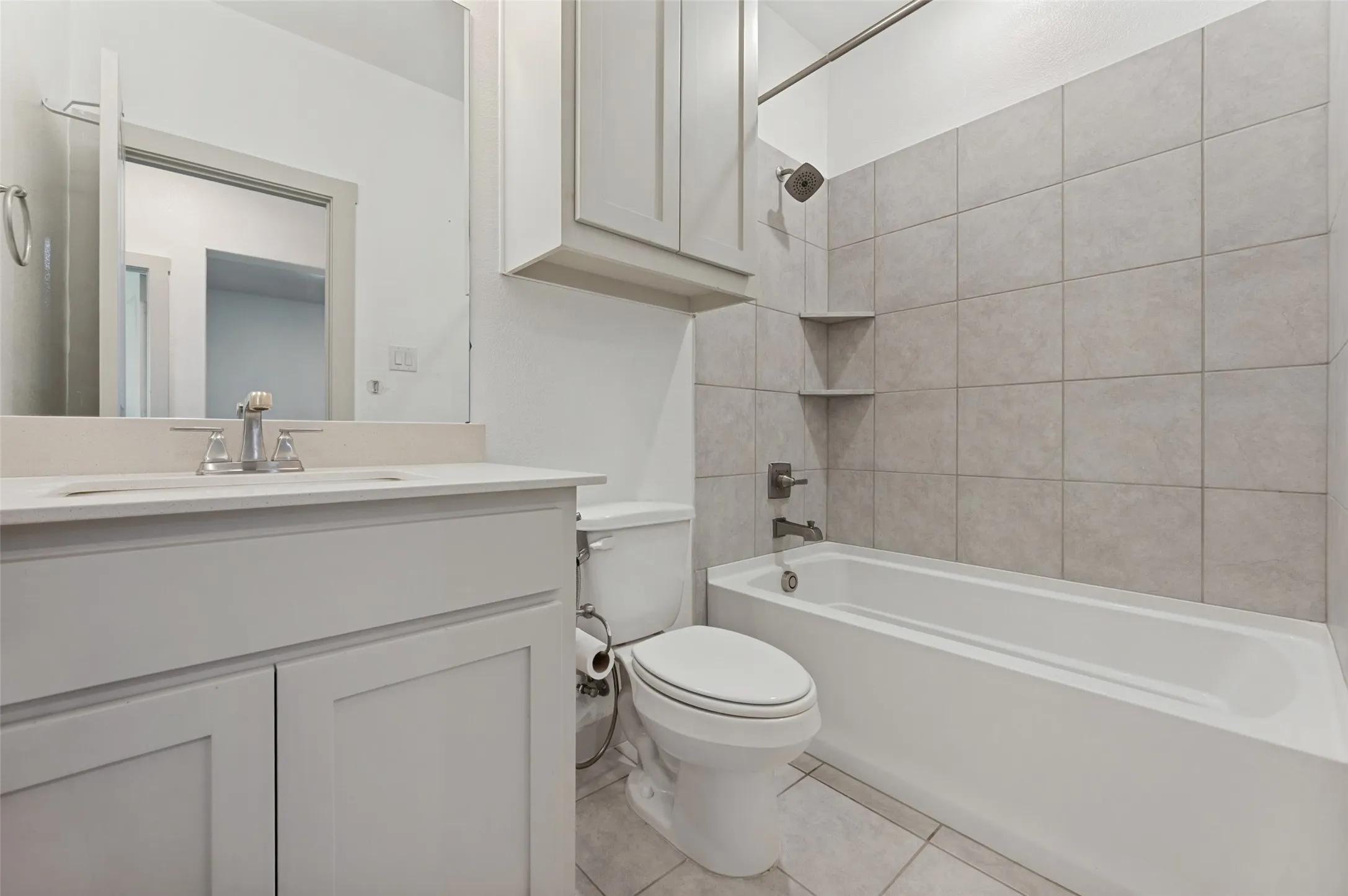 Secondary full bathroom on second level.