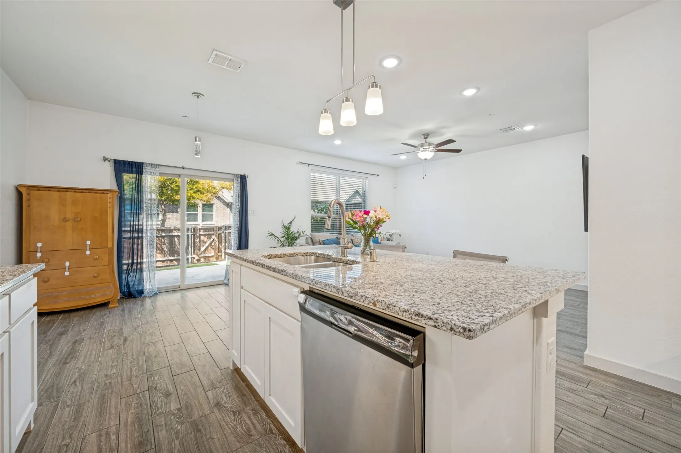 Spacious kitchen with stainless appliances.