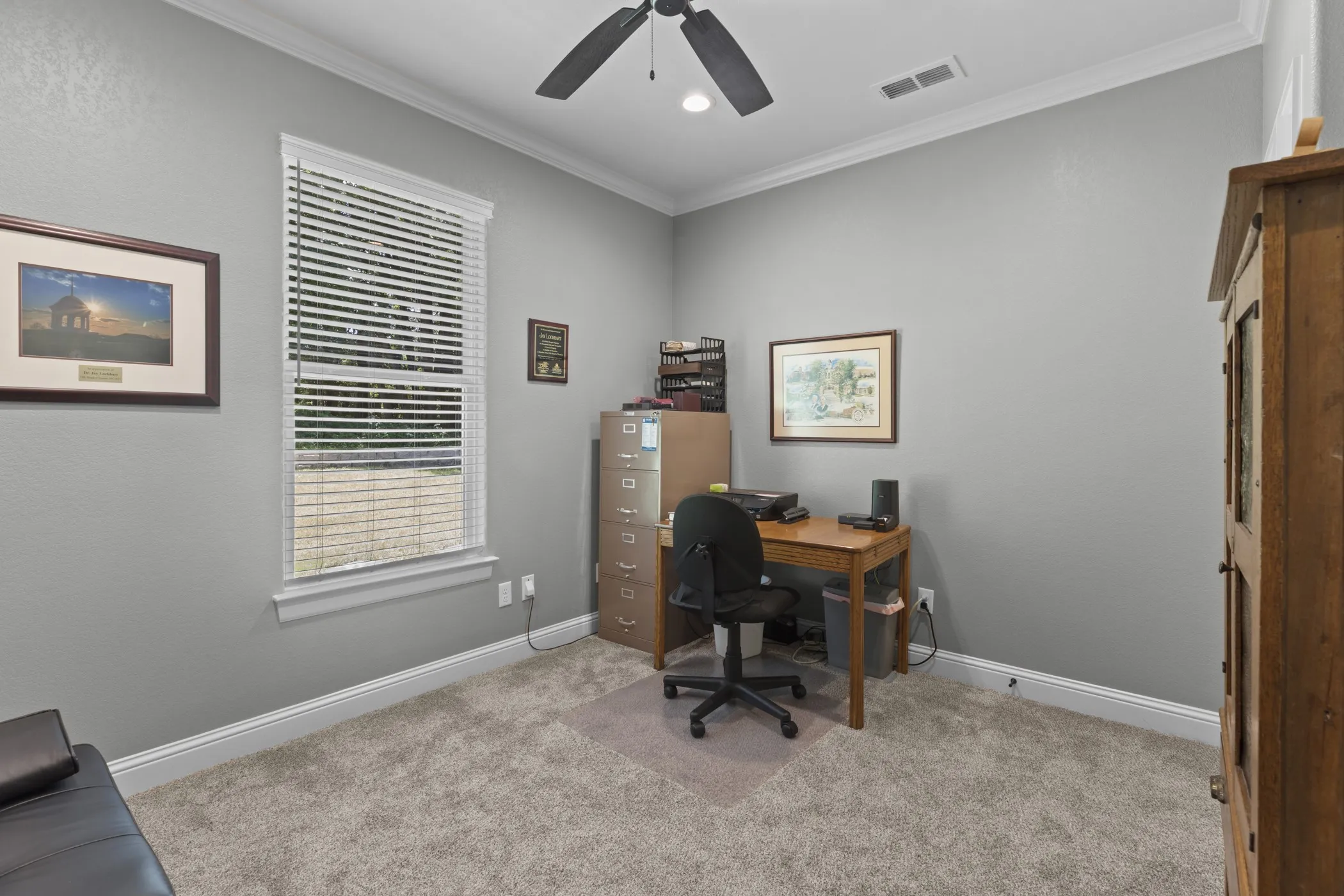 Recessed ceiling fan, crown molding, white trim, window with blinds, and light gray wall paint