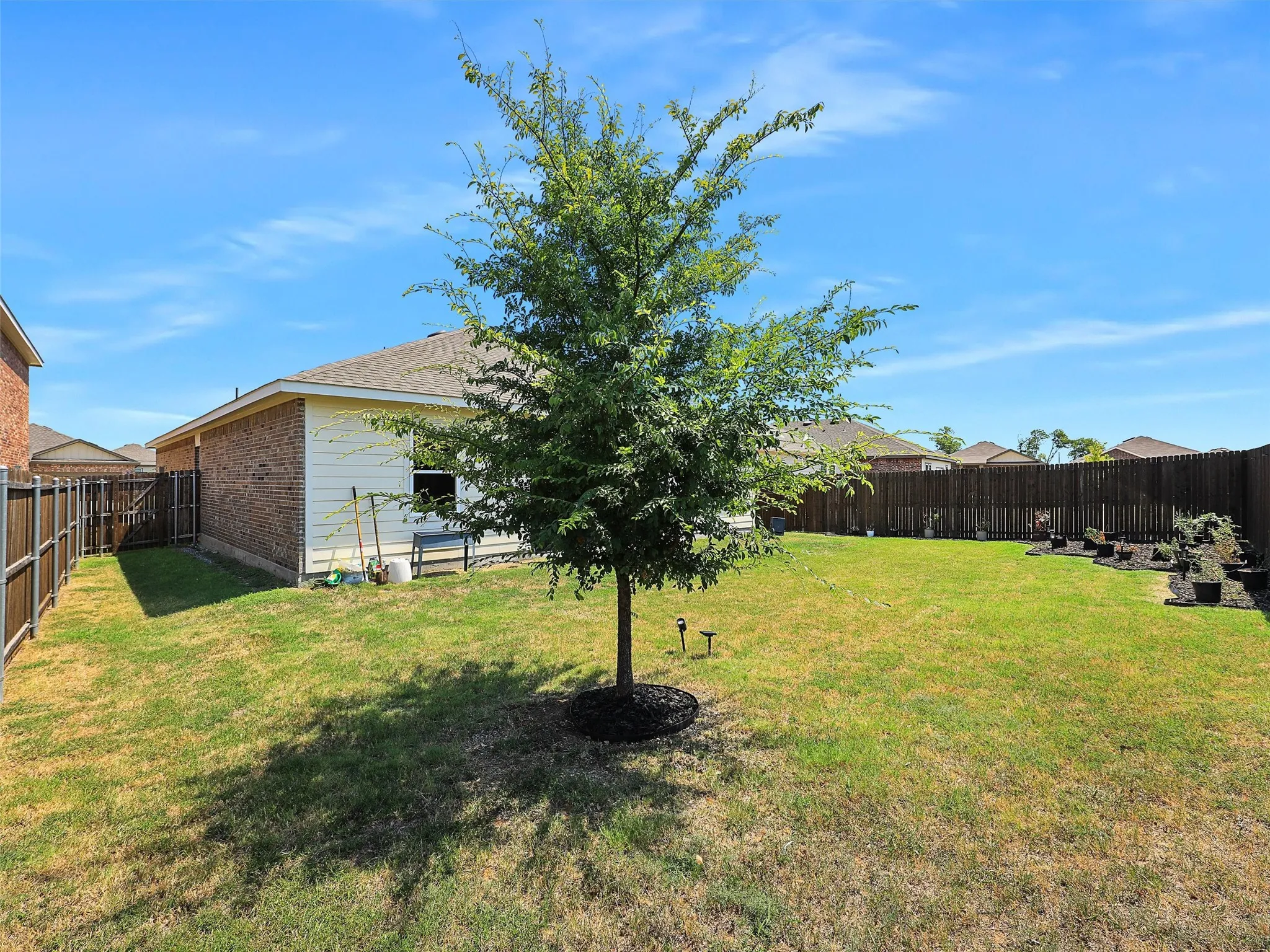 Plenty of backyard space to enjoy sunny days, fresh air, and time outside.