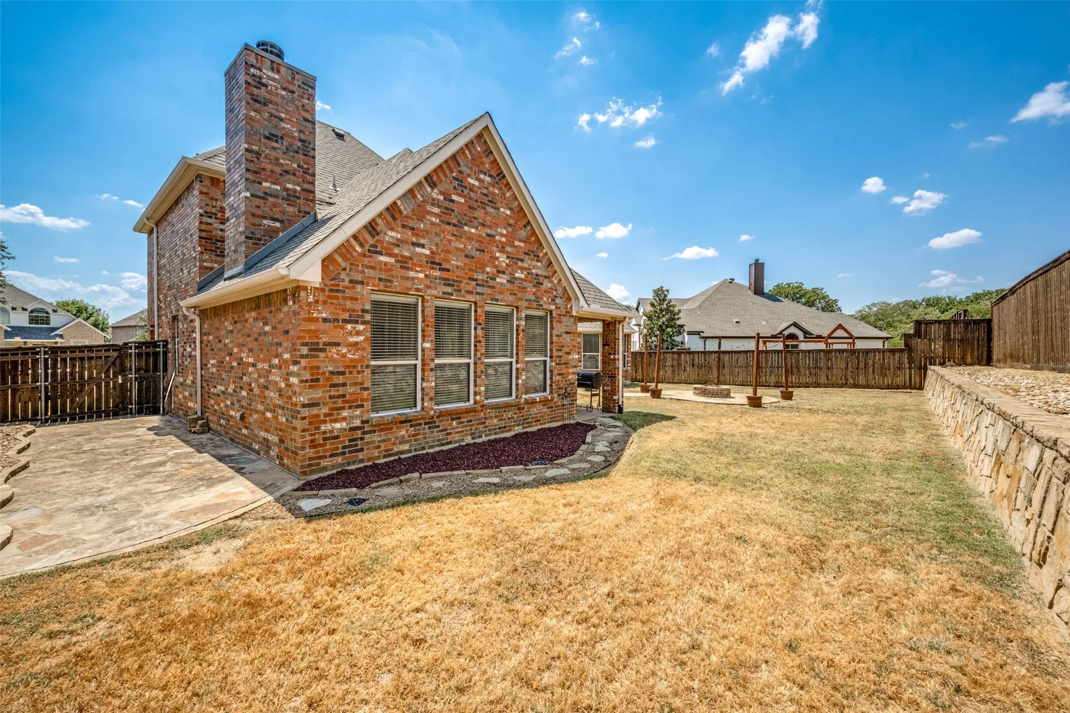 Large back yard will accommodate a pool and have plenty of space left over