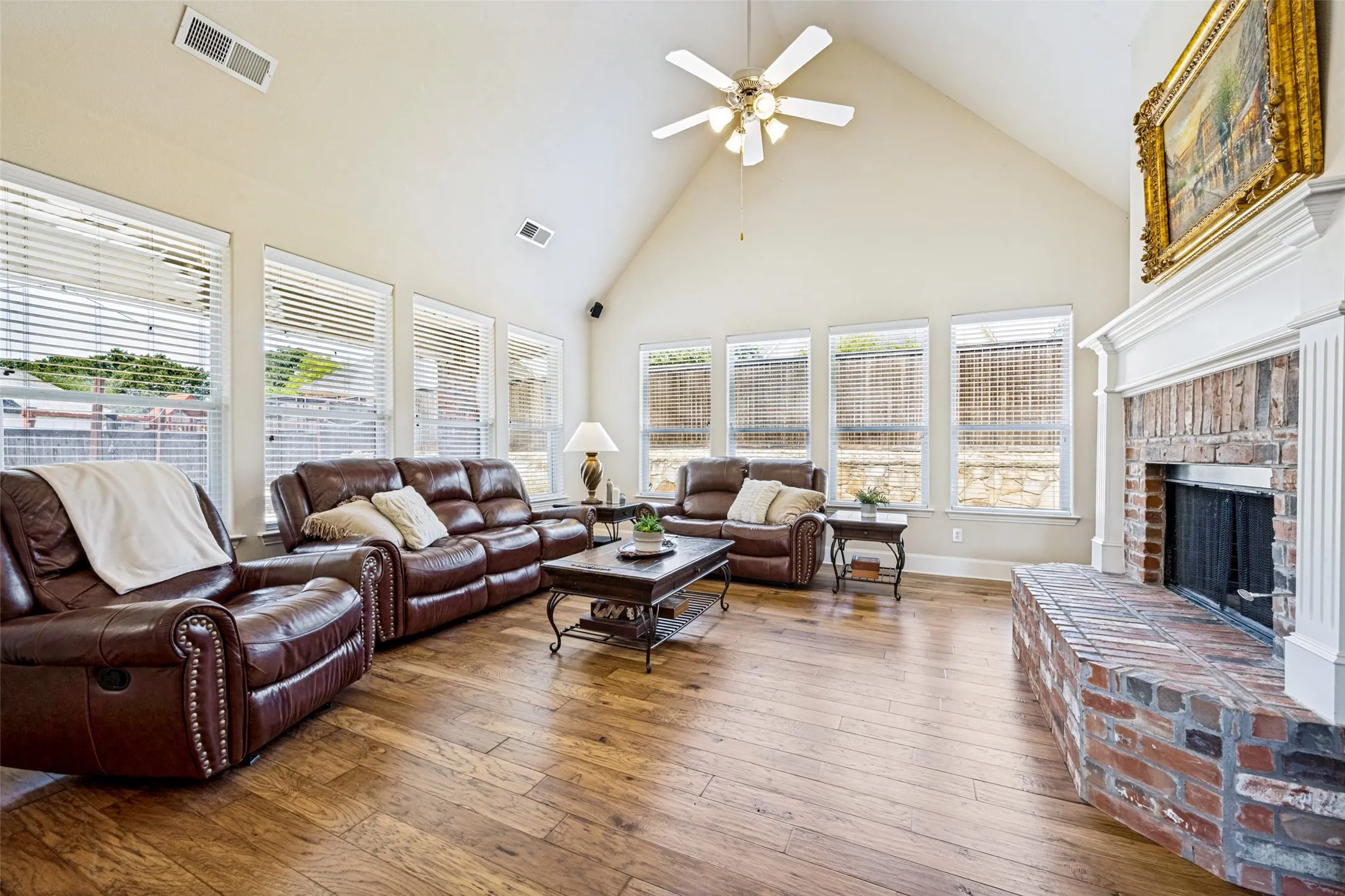 flowing wood floors and large brick hearth, gas start wood burning fireplace,