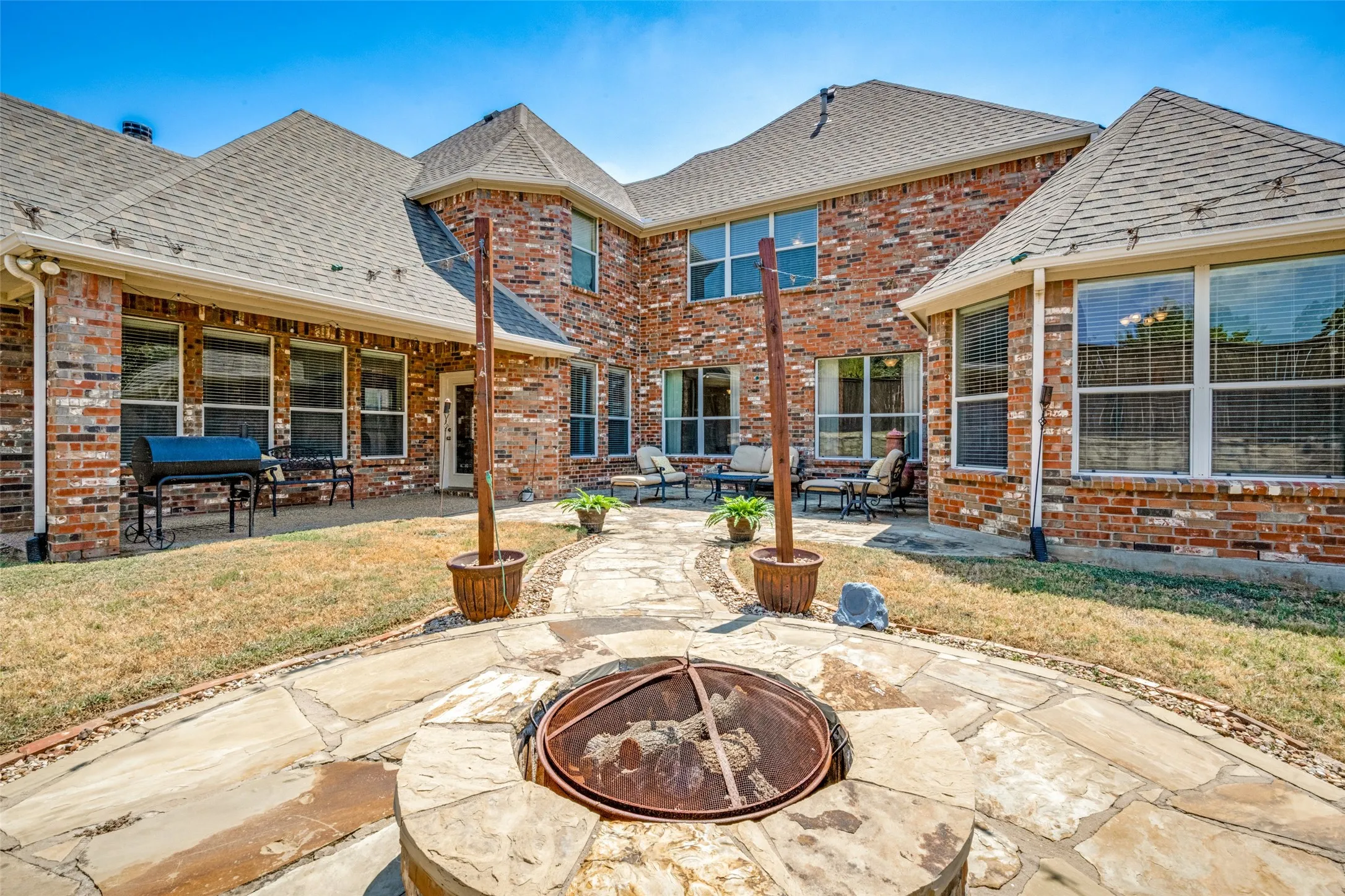 Backyard with custom firepit