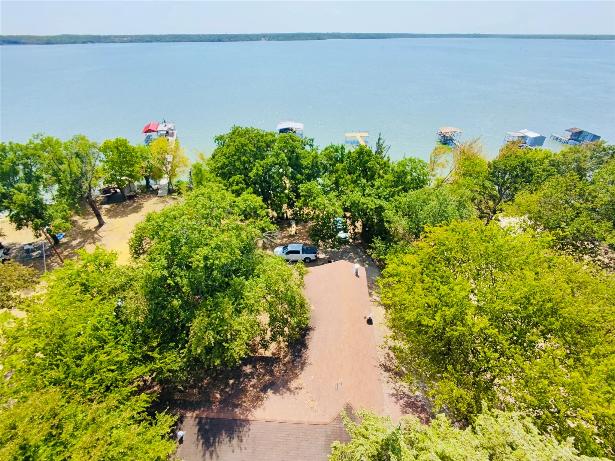 Waterfront property with mature trees.