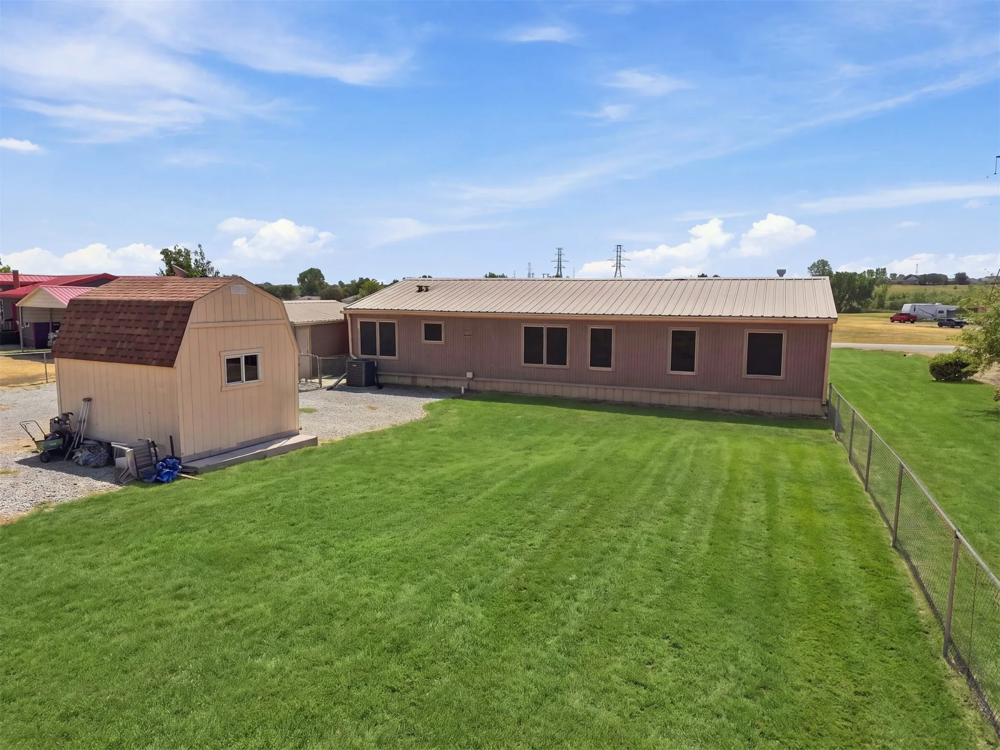 Very well maintained backyard, chainlink fencing around the property, detached storage shed comes with the property.