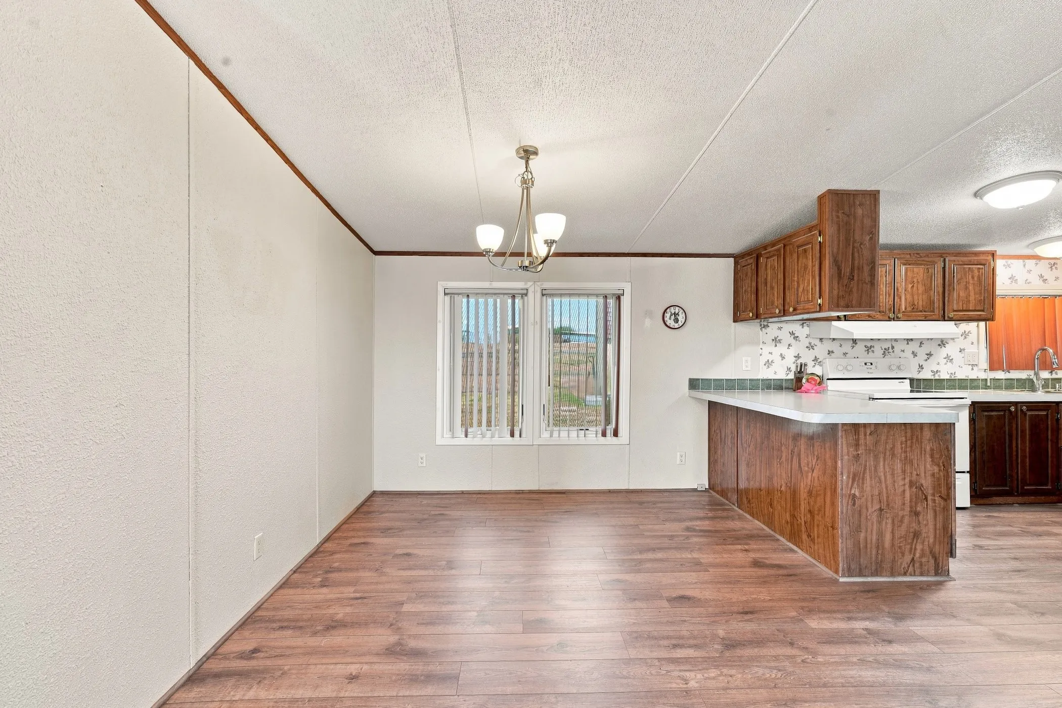 LVP throughout dining and kitchen area, recently installed August 2026