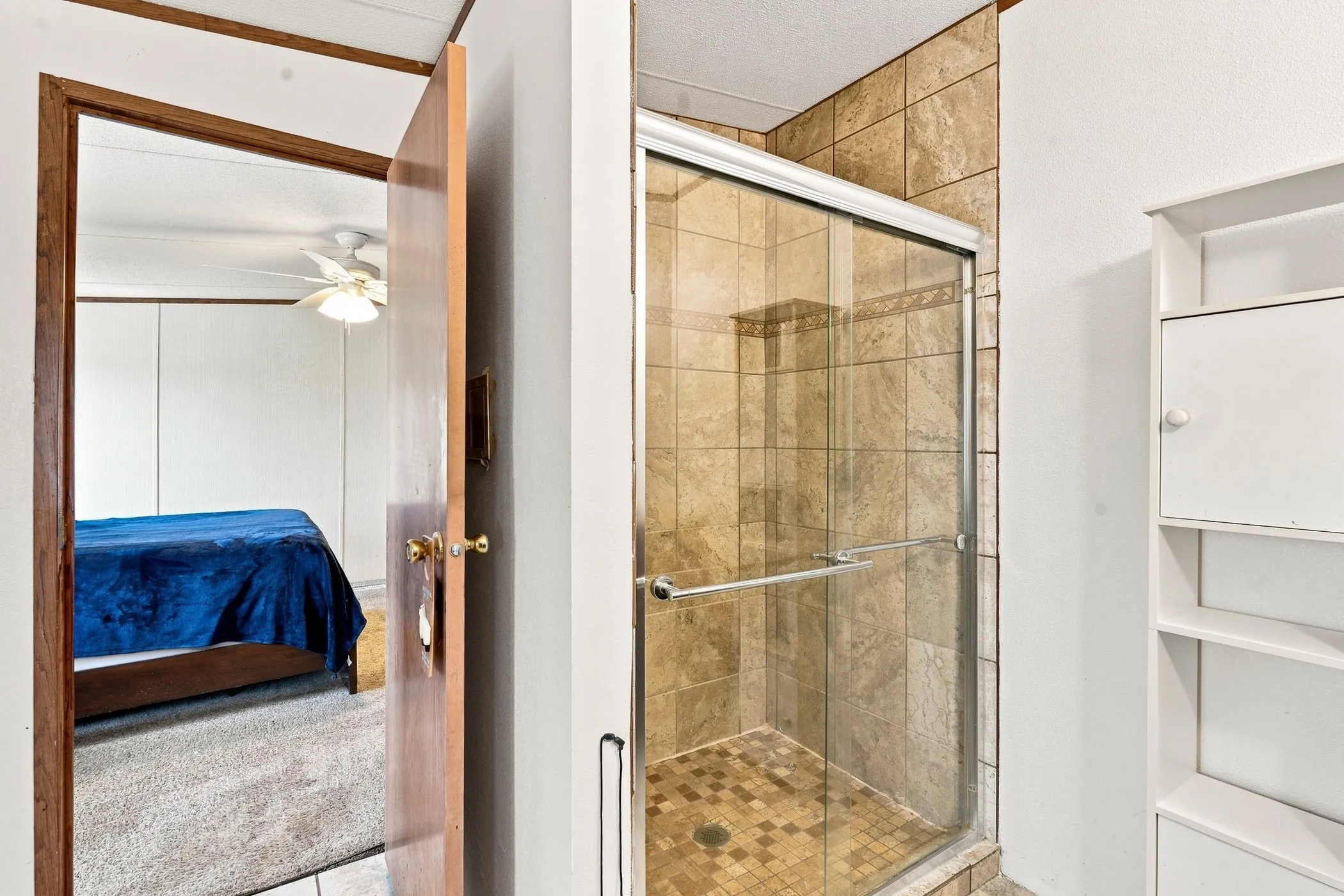 Tiled shower with glass enclosure