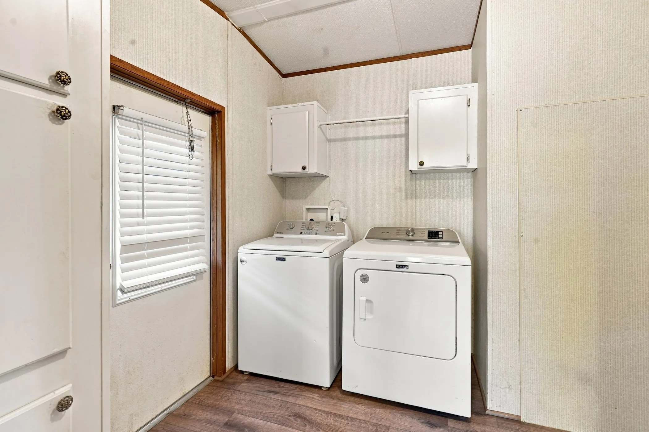 Nice size laundry area off the side entry door - Washer/Dryer comes with the property
