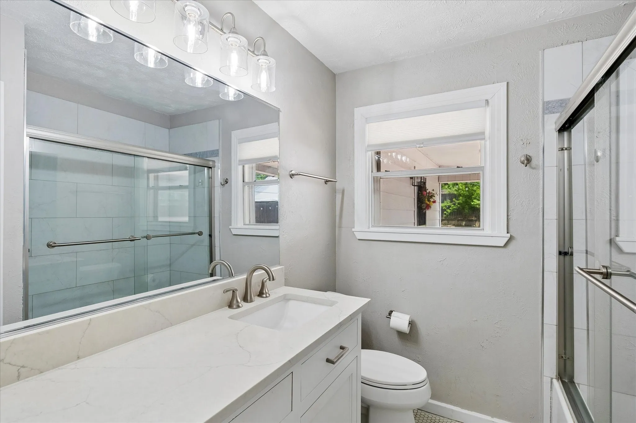 Contemporary vanity with undermount sink and brushed nickel faucet