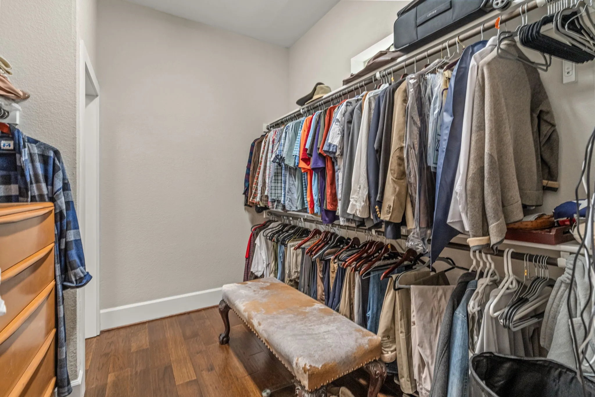 Master Walk-In Closet with cut through to utility room