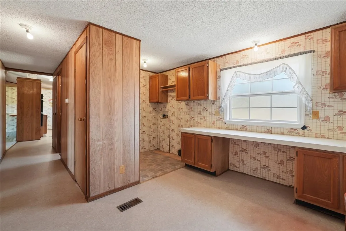 Wood-paneled hallway with integrated doors