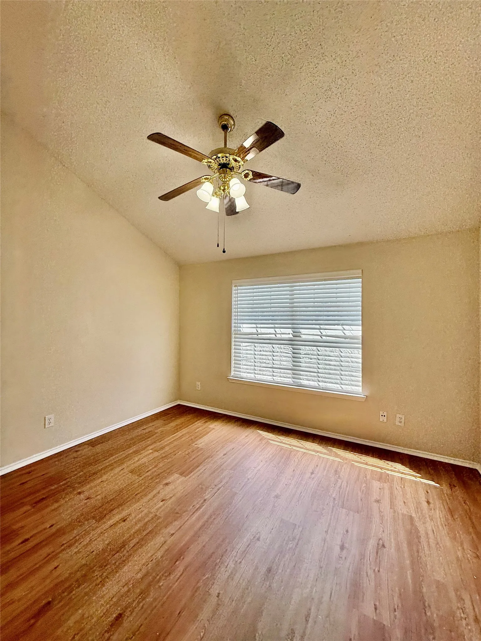 west upstairs bedroom with vaulted ceilings
