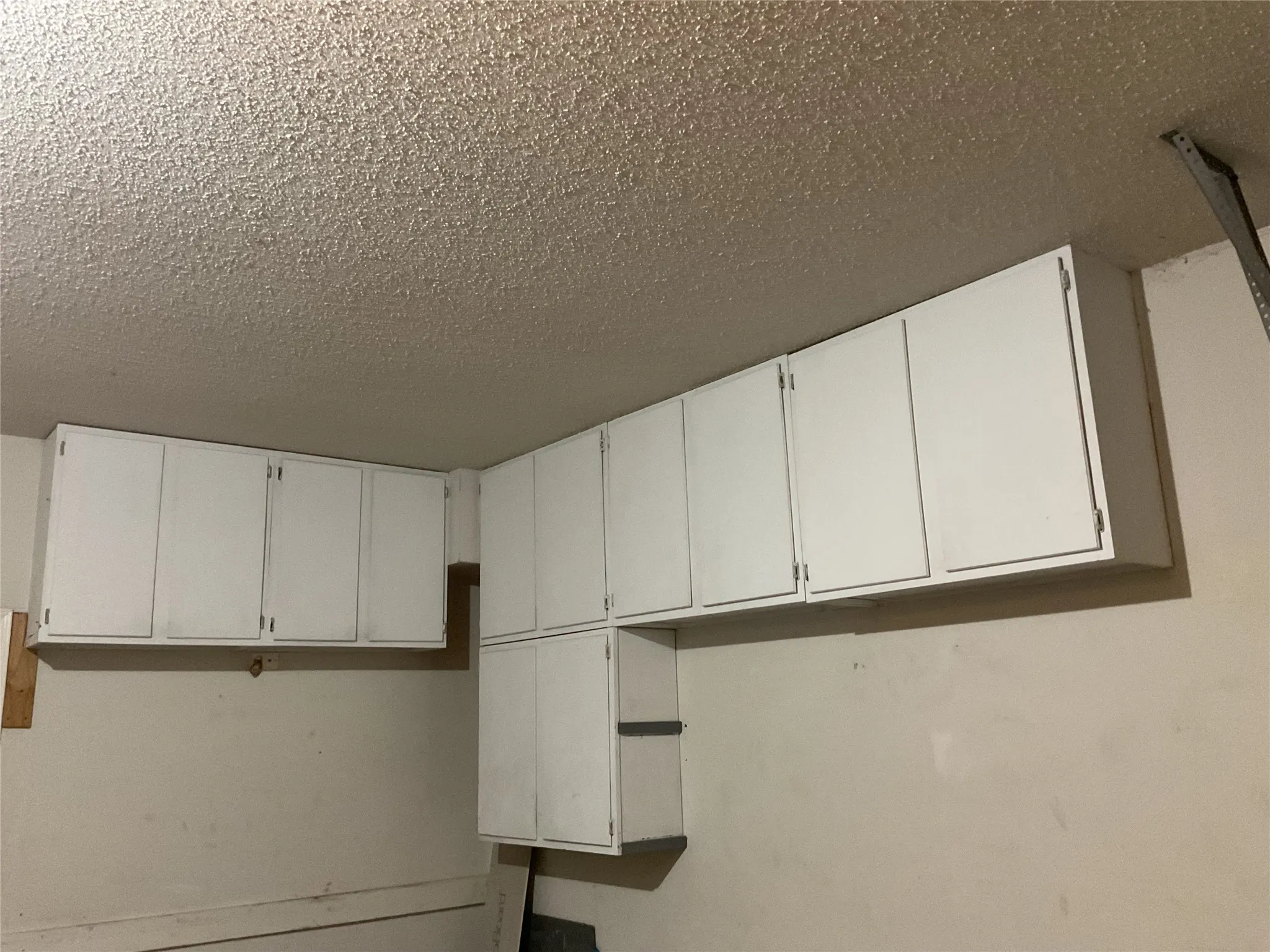 Garage features ample storage with many built in cabinets