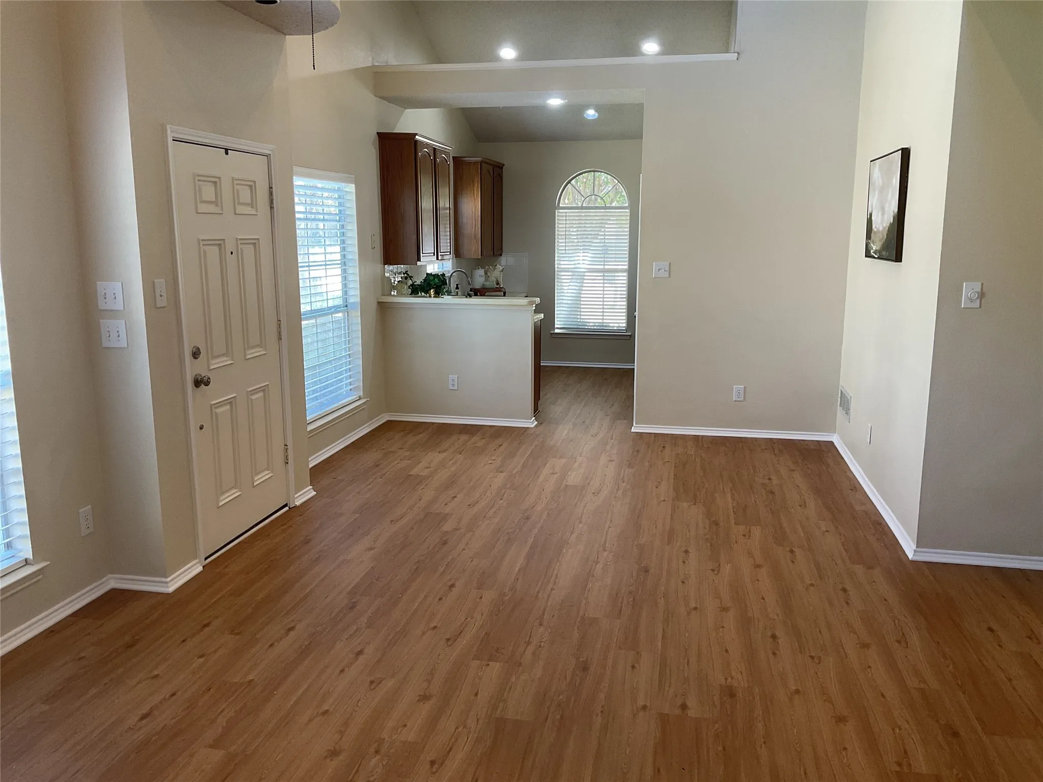 dining room just to the left of the entry before the kitchen. notice the vaulted ceilings and open floor plan
