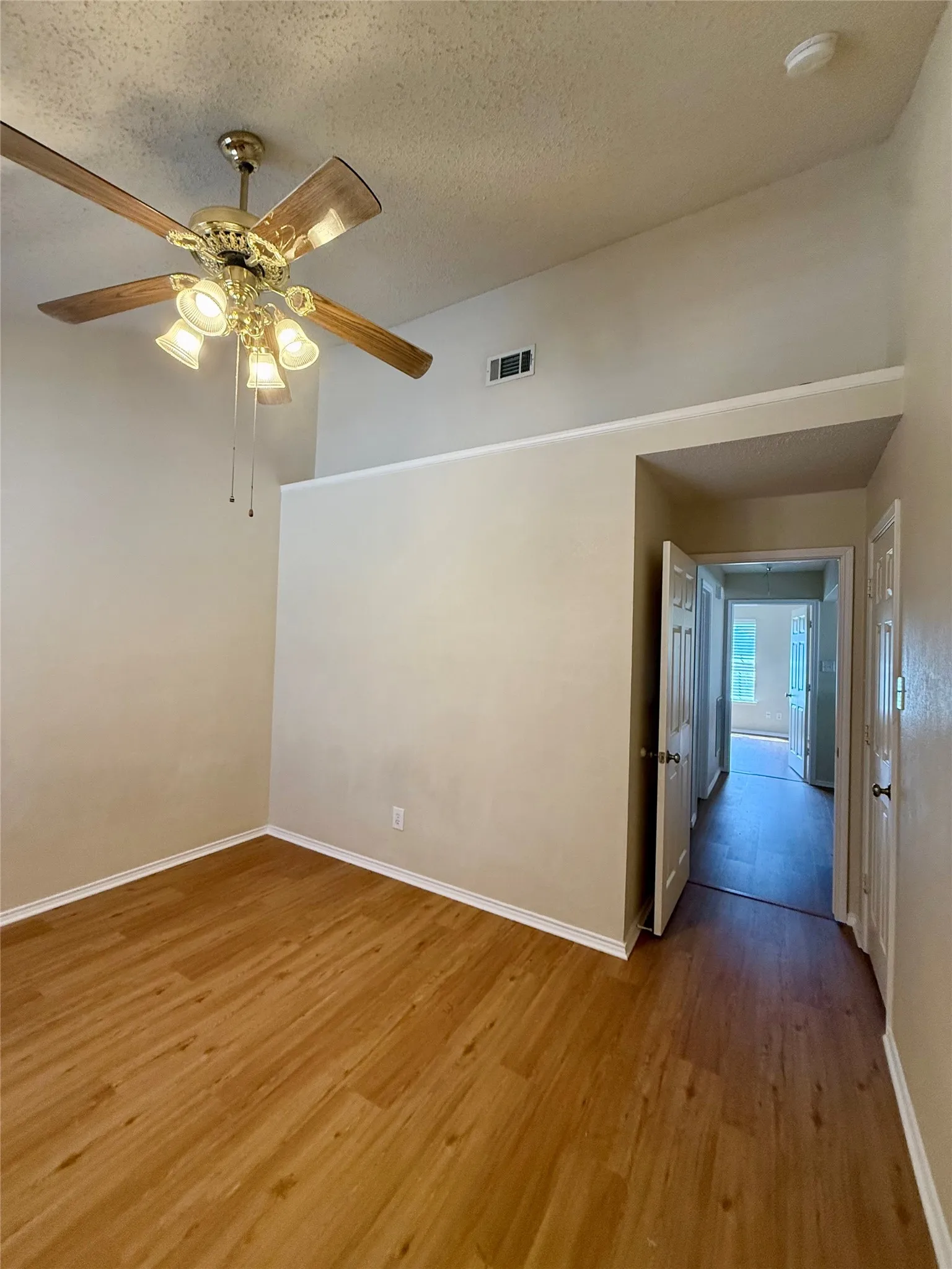 east bedroom also features vaulted ceilings and walk in closet