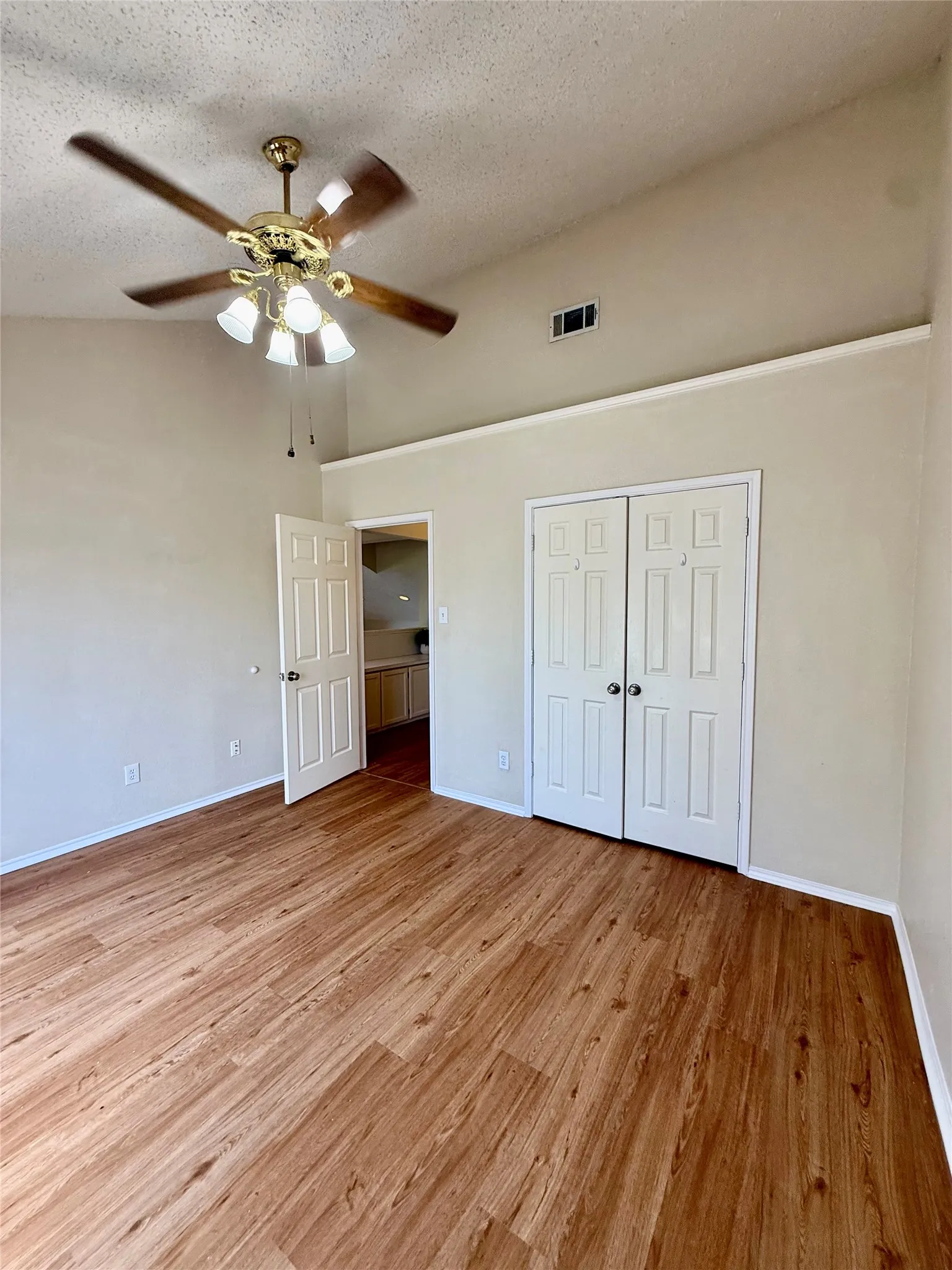 west upstairs bedroom with vaulted ceilings