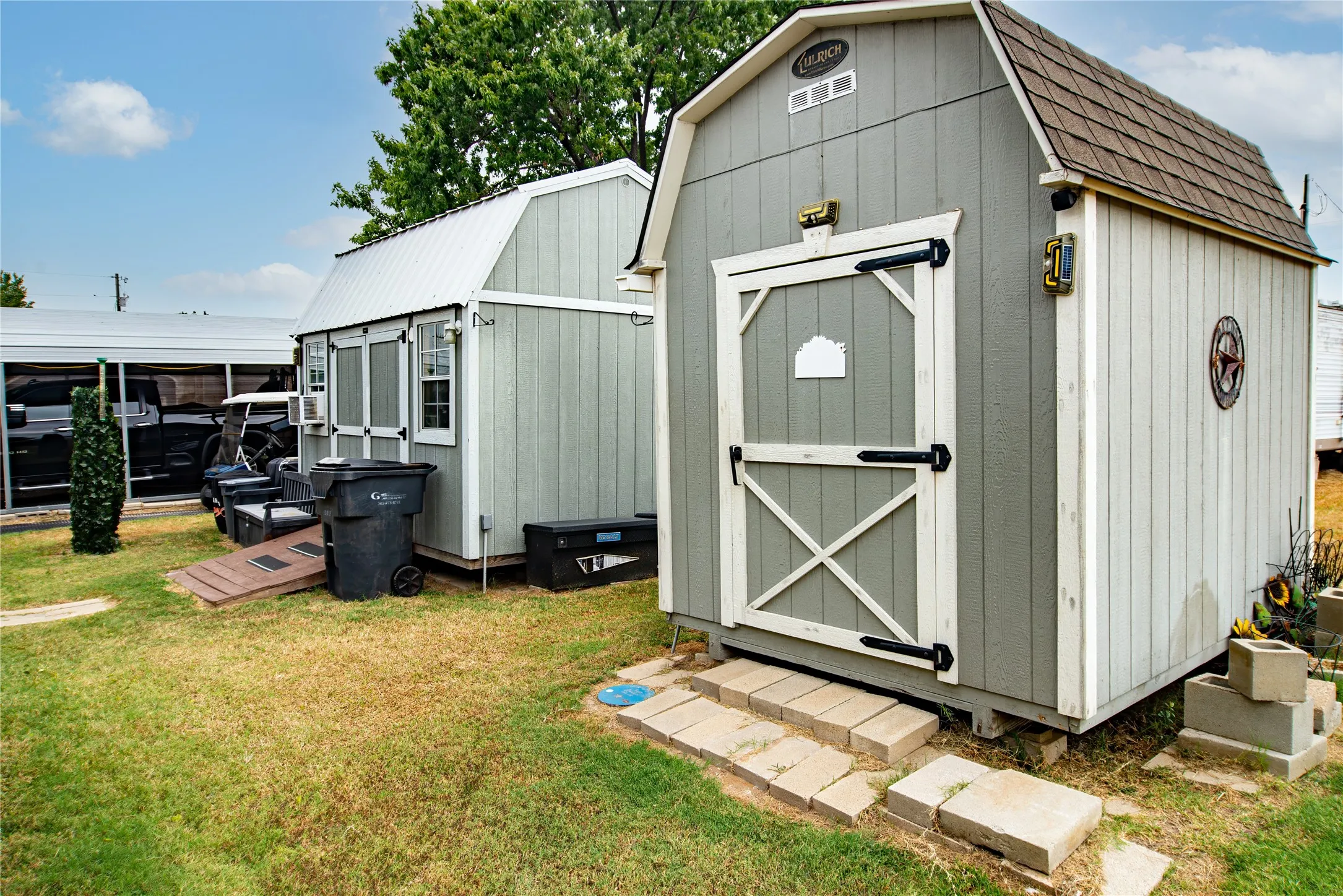 Two large storage buildings in the back of the property.