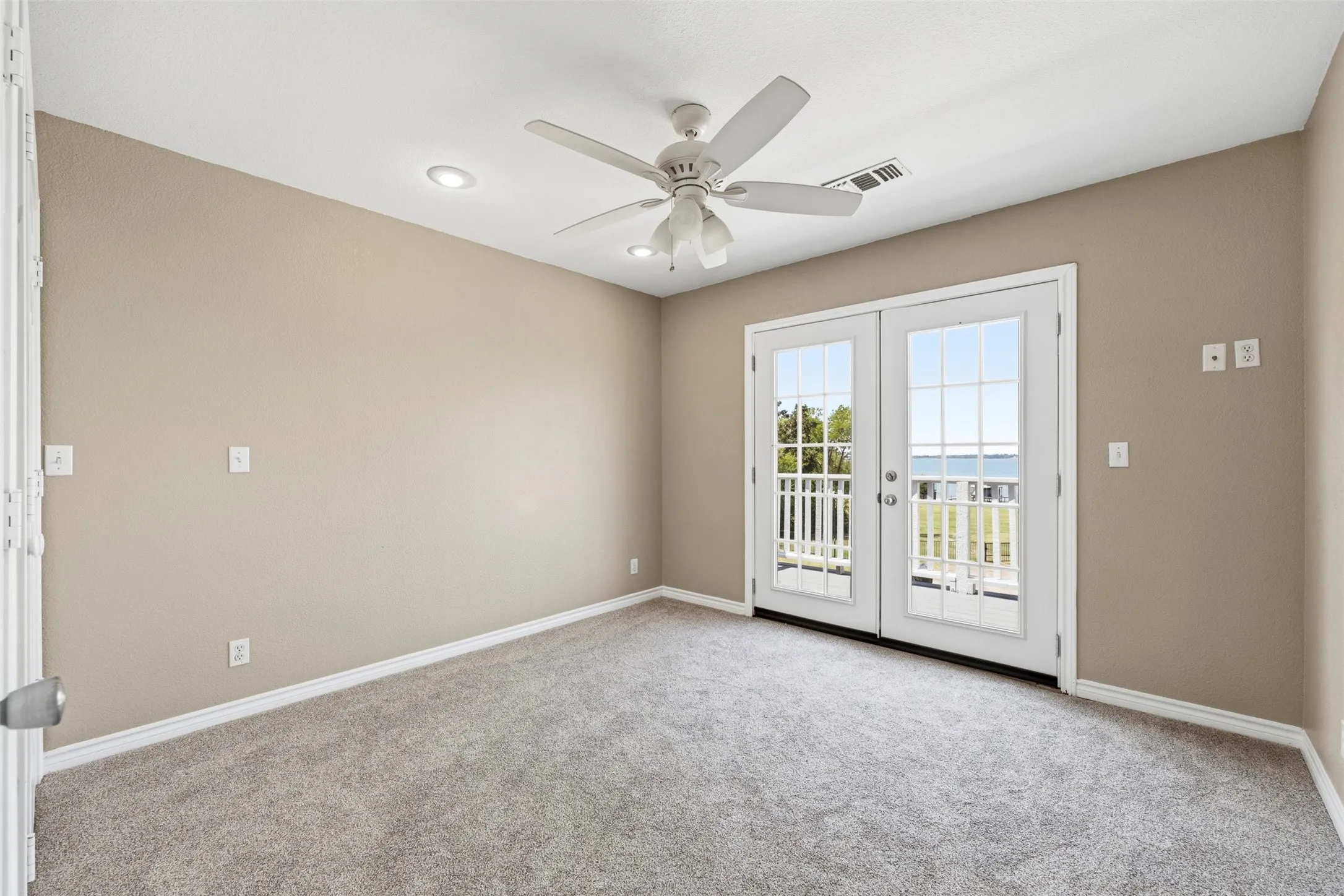 Upstairs Bedroom with balcony overlooking the lake