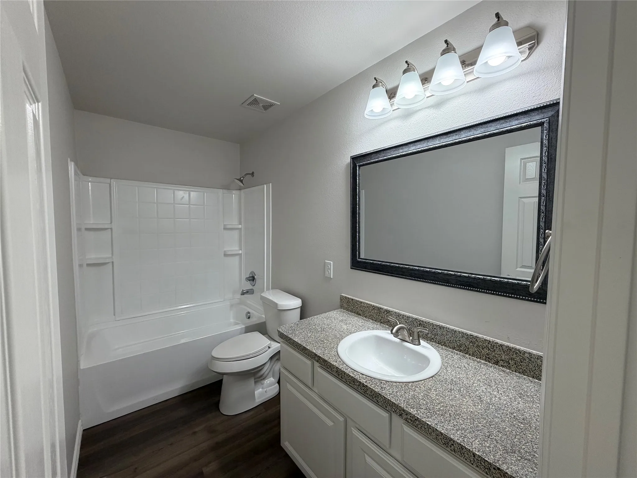Off the hall between first and second bedrooms