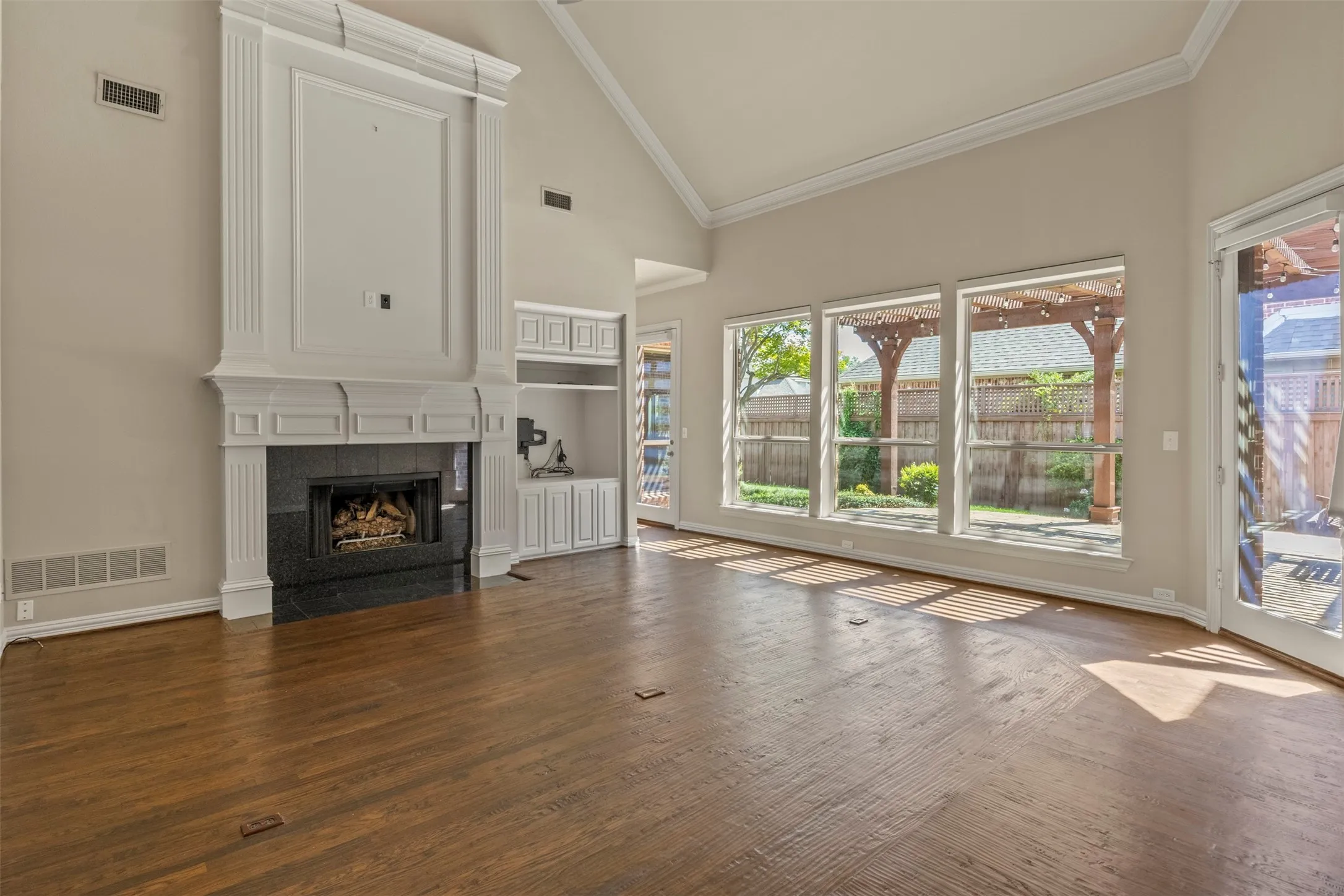 Vaulted ceiling and a wall of windows to the patio.