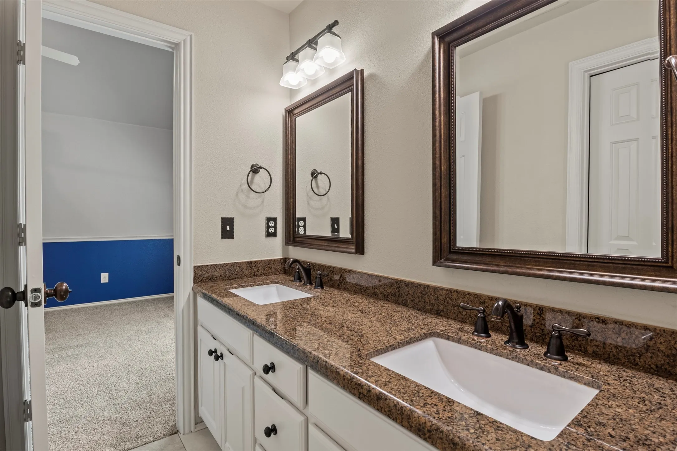 Double sinks and granite counter top.