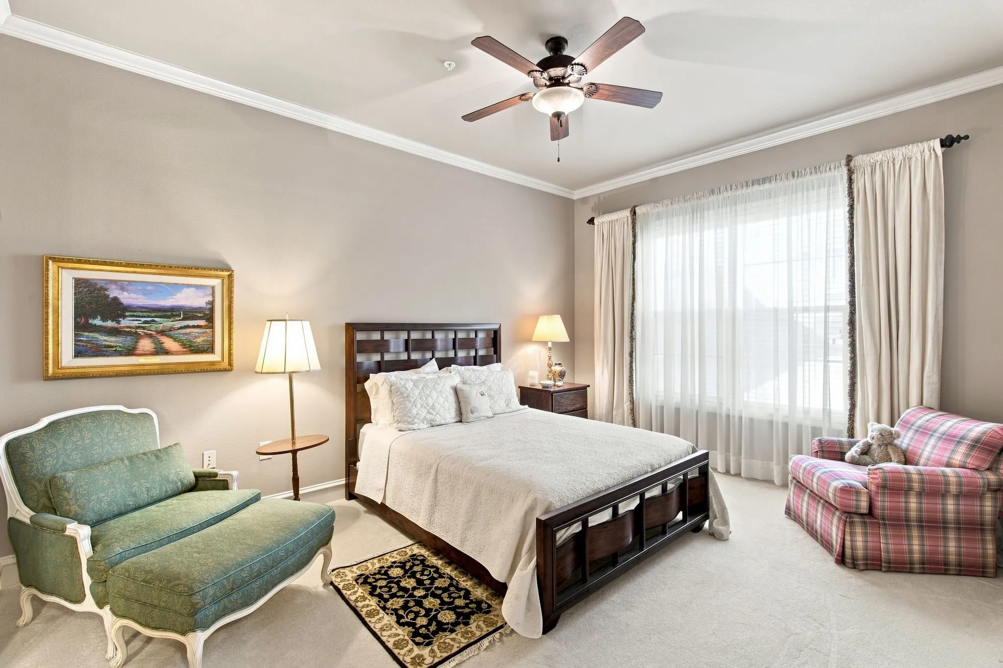 Crown molding details, carpet and ensuite bathroom with large walk-in closet.