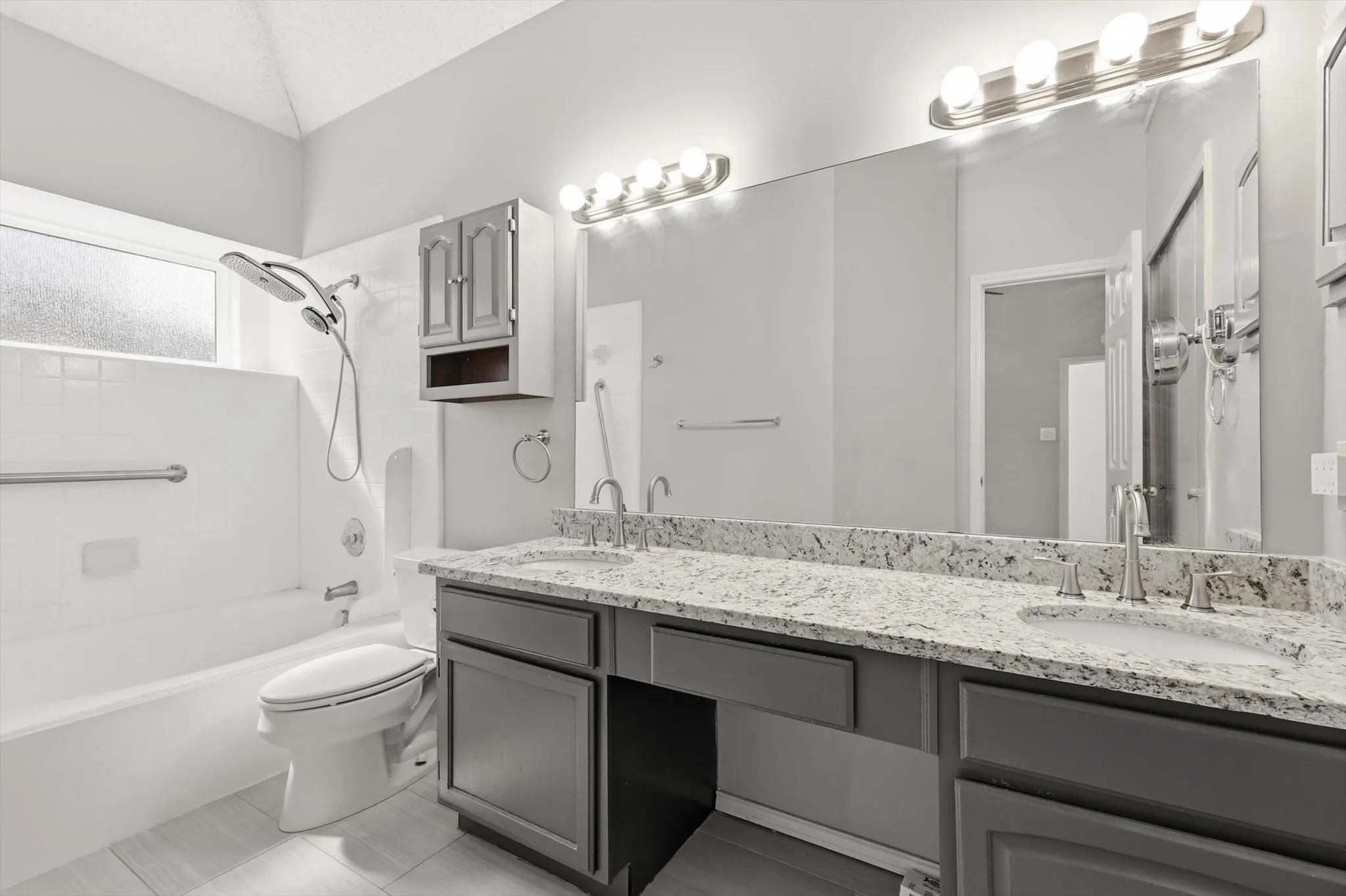 Dual vanity with stone countertop and undermount sinks