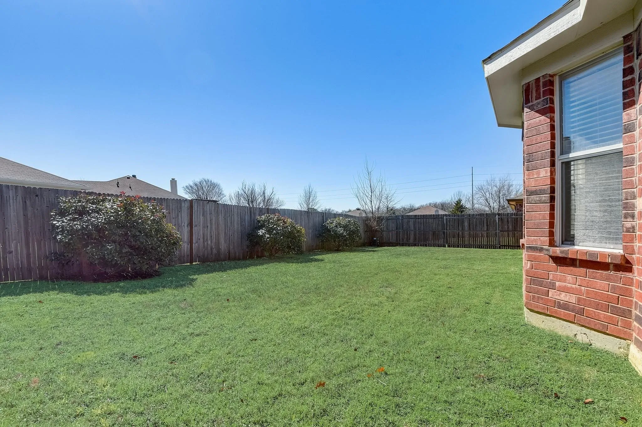 View of yard with a fenced backyard
