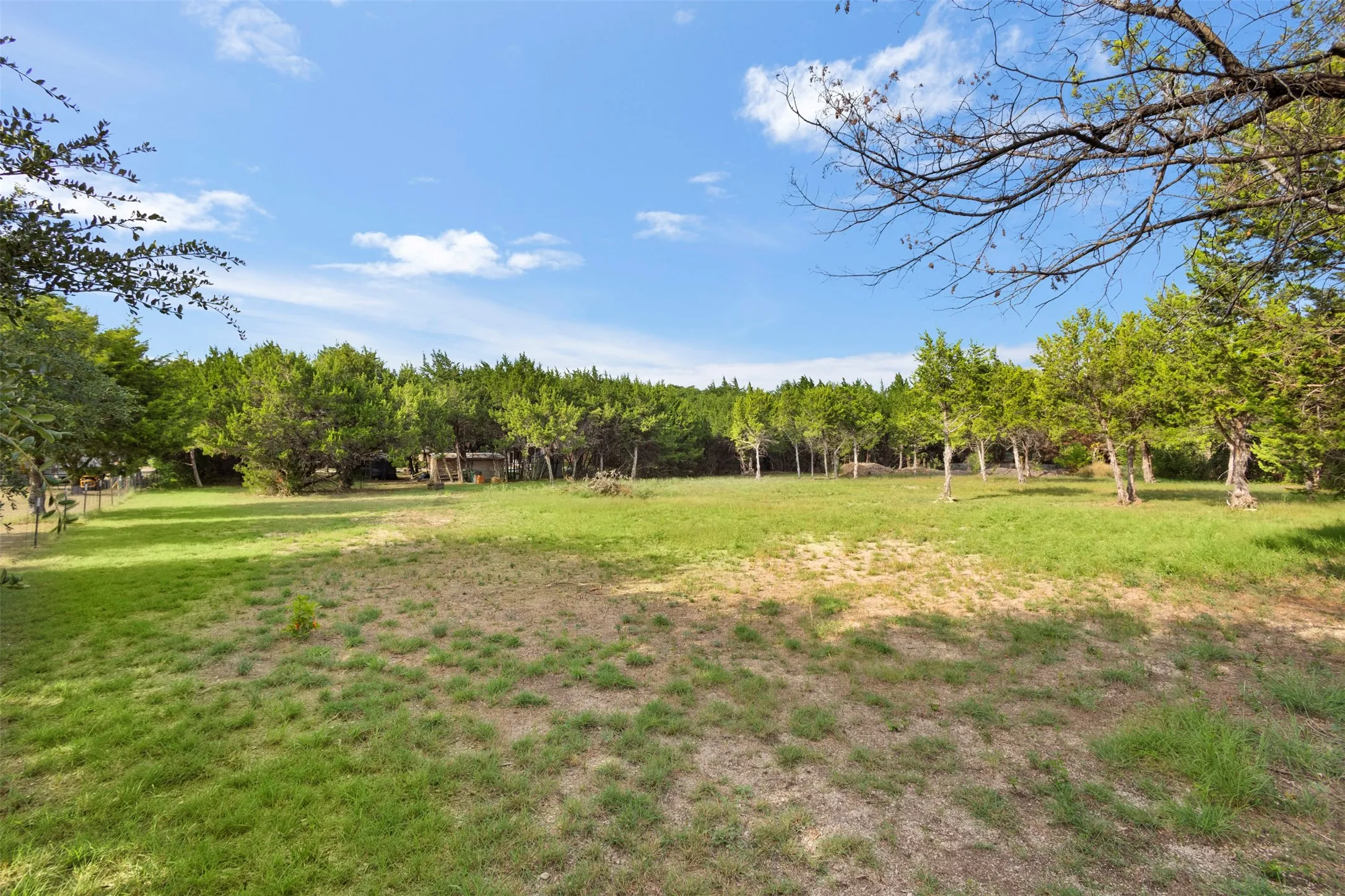 Expansive lot featuring mature trees and open green spaces