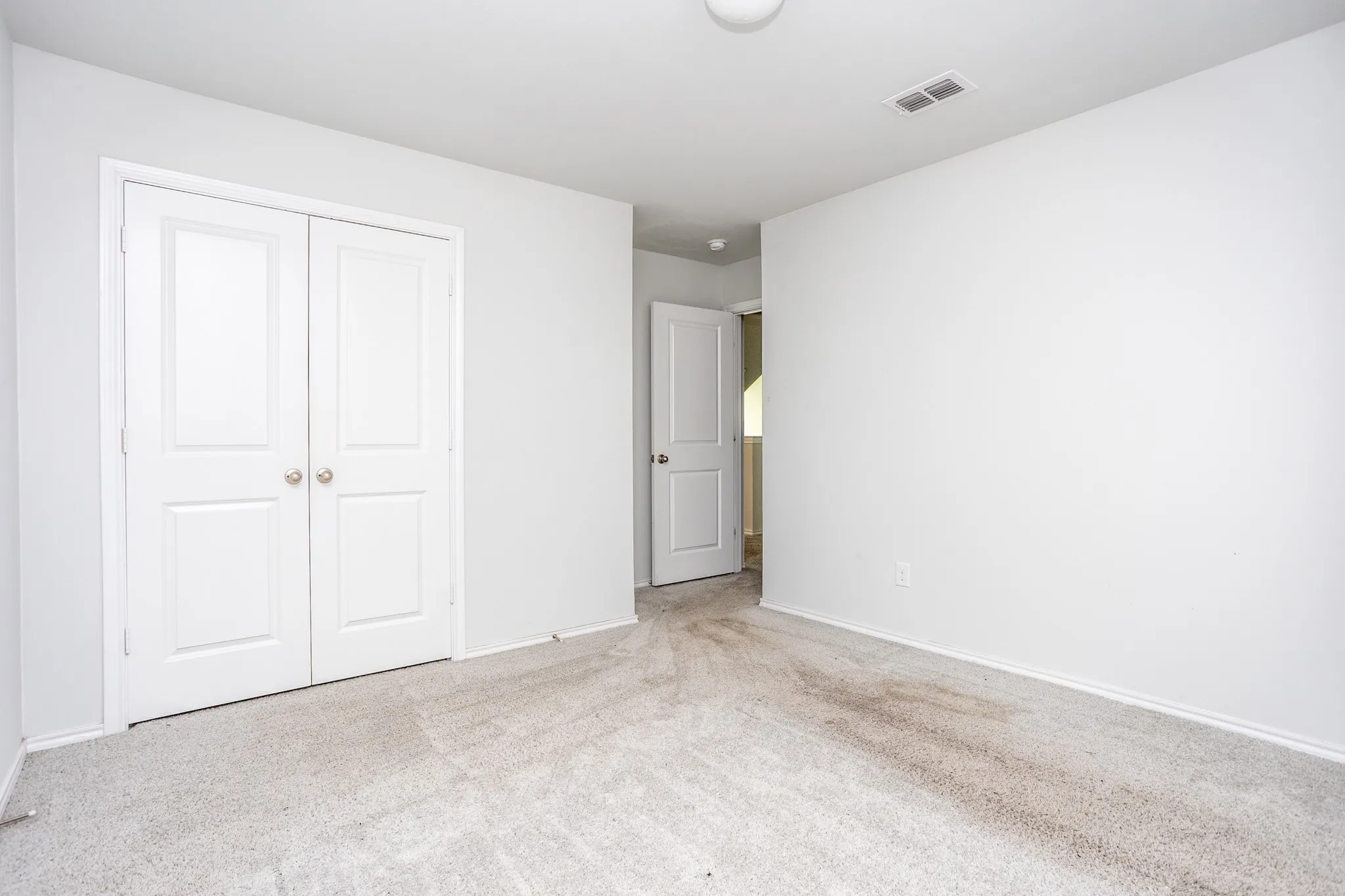 Double bifold closet doors with brushed nickel hardware