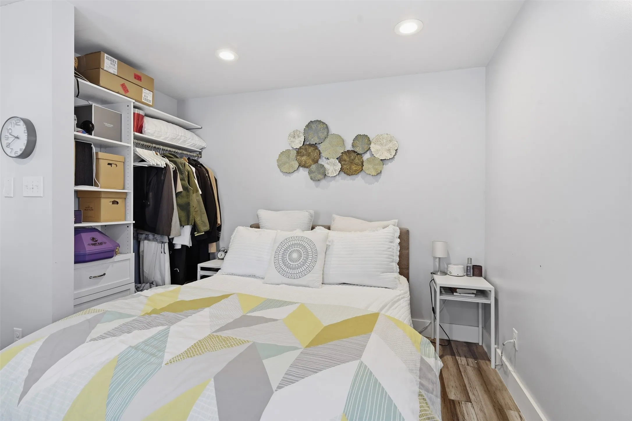 Recessed ceiling lighting, wood-finish flooring, and built-in closet organization system