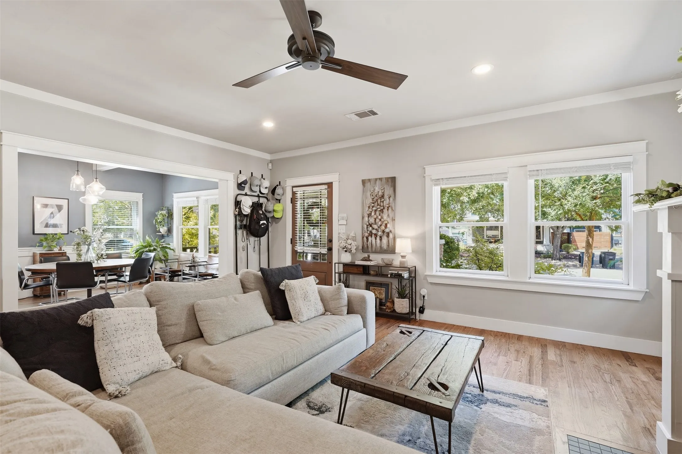 Wood-finish flooring throughout, recessed lighting, and a ceiling fan