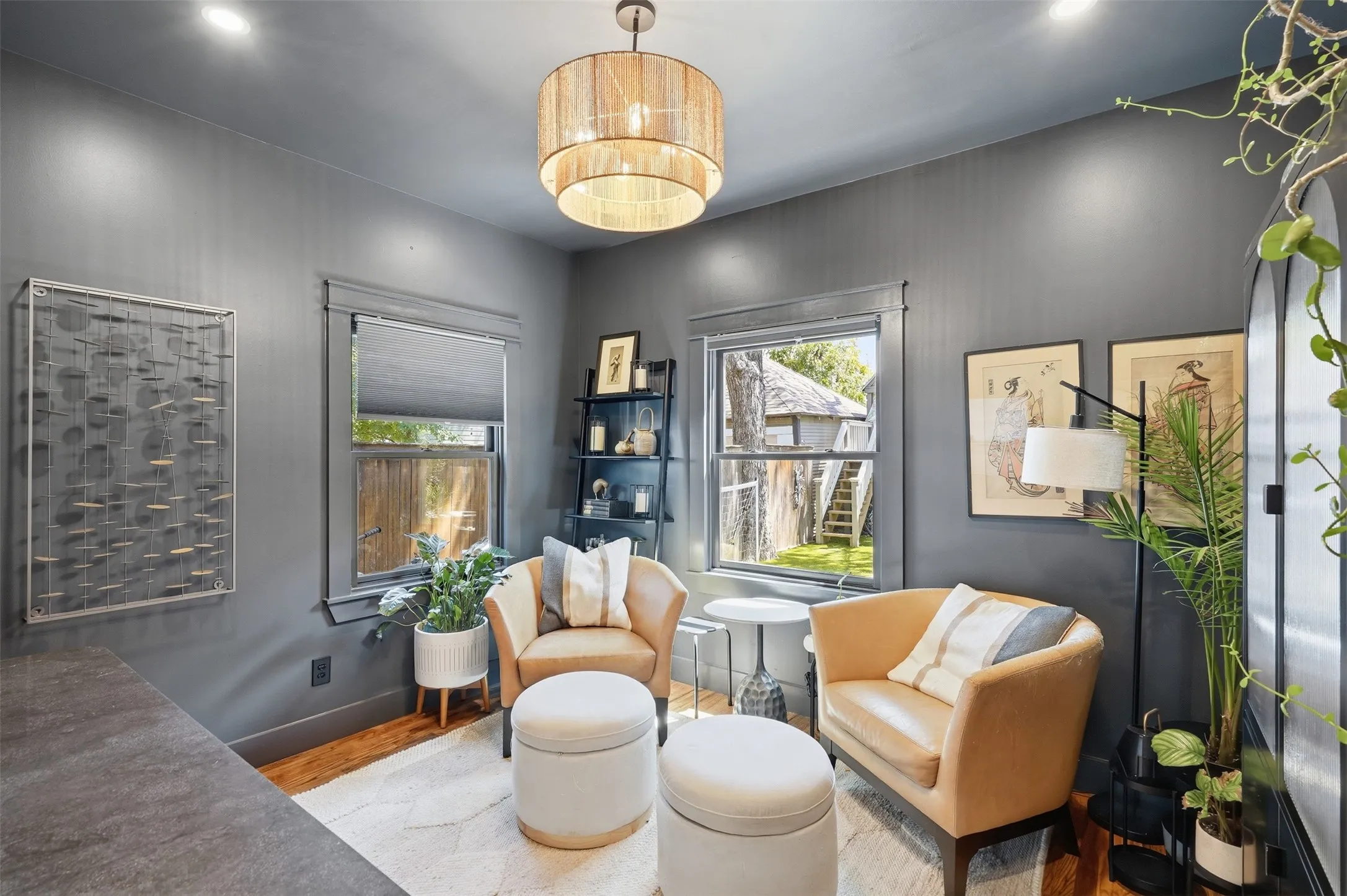 Wood-finish flooring, recessed lighting, and a drum pendant light fixture
