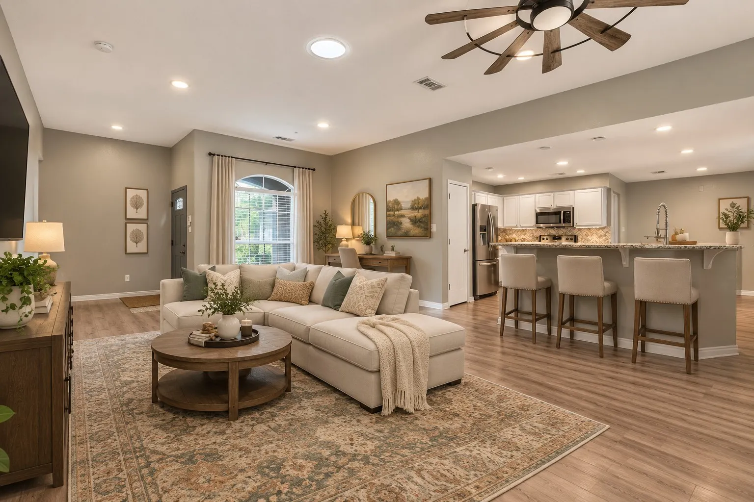 Virtually staged Open-concept living area featuring wood-finish flooring, recessed lighting, and a decorative ceiling fan