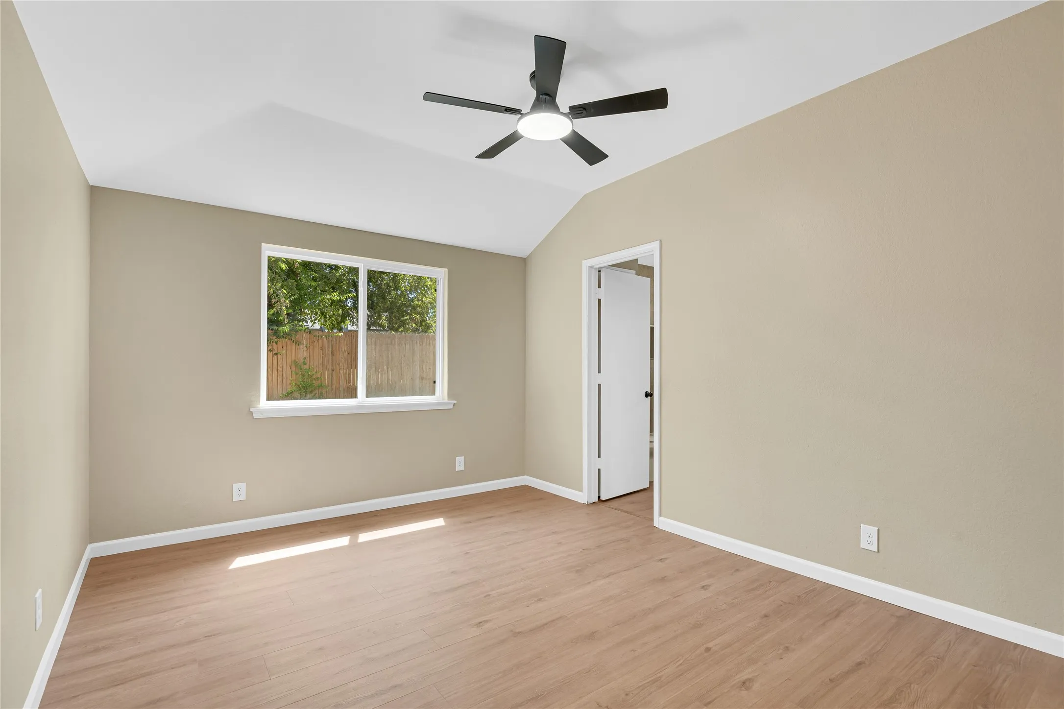 Vaulted ceiling with a contemporary ceiling fan