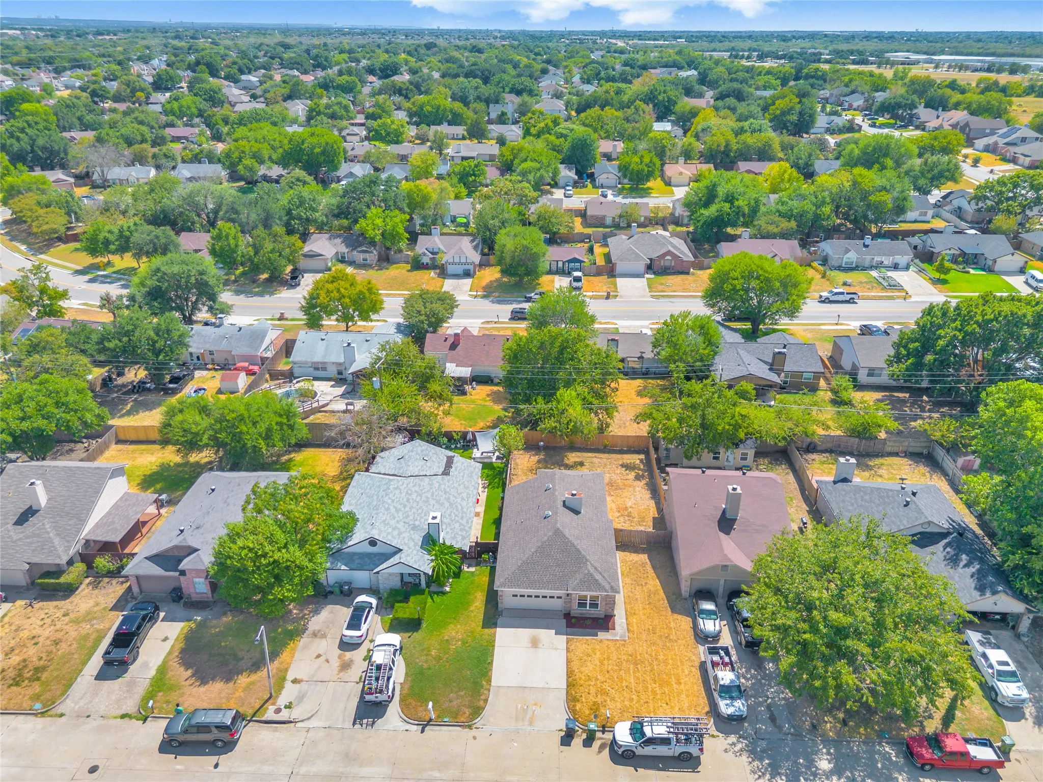 Residential neighborhood featuring mature trees and established homes
